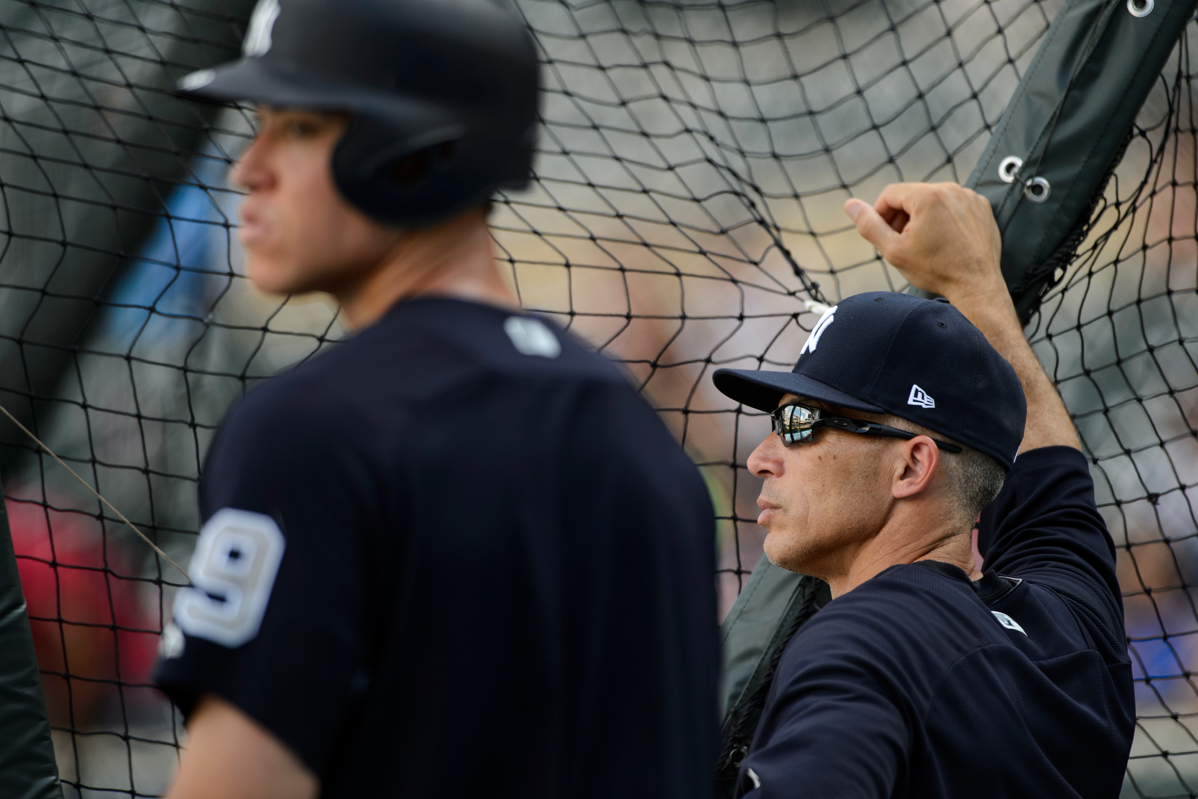 MINNEAPOLIS, MN - JULY 17: Aaron Judge #99 and manager Joe Girardi #28 of the New York Yankees look on during batting practice before the game against the Minnesota Twins on July 17, 2017 at Target Field in Minneapolis, Minnesota. The Twins defeated the Y
