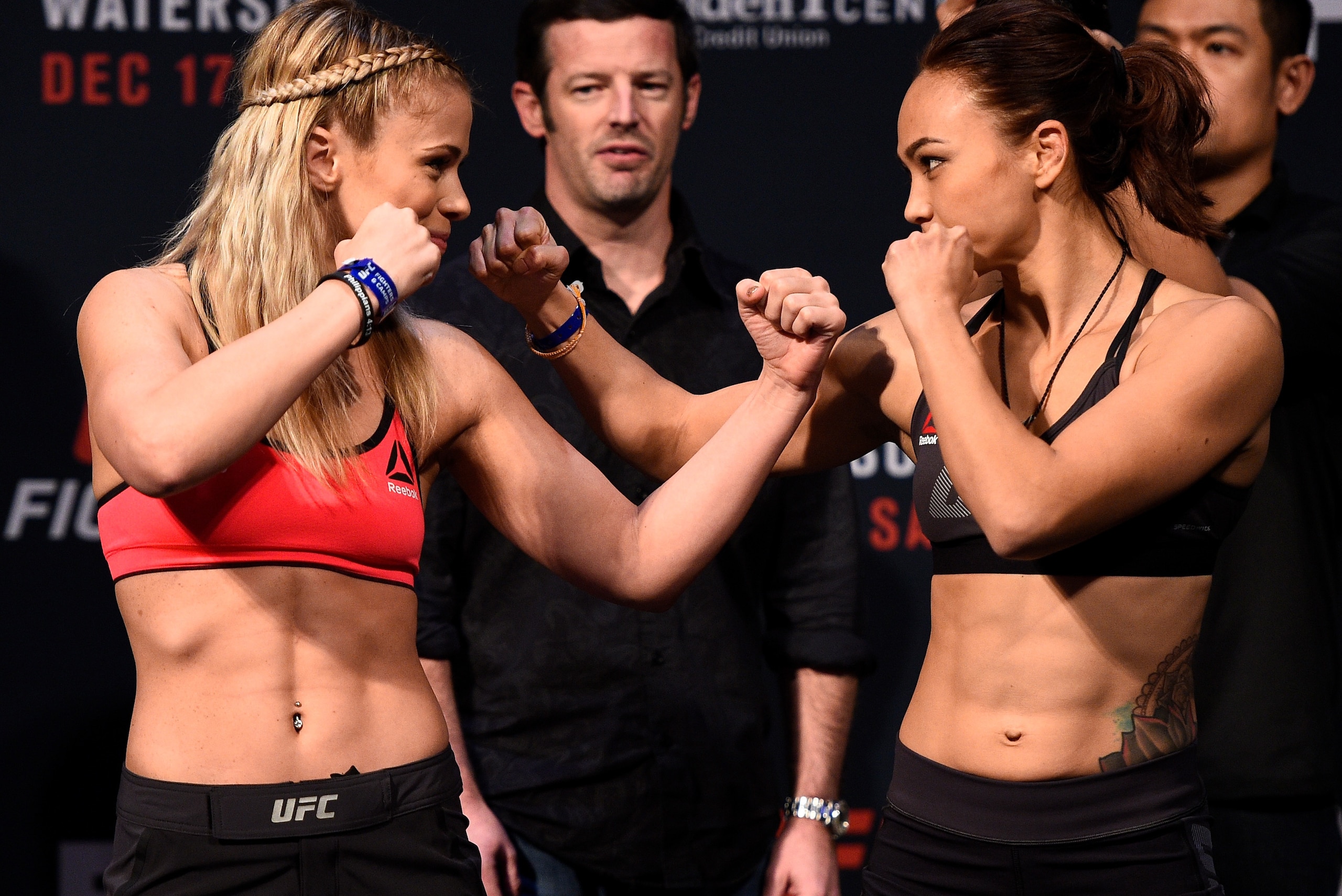 SACRAMENTO, CA - DECEMBER 16:  (L-R) Paige VanZant and Michelle Waterson face off during the UFC Fight Night weigh-in inside the Golden 1 Center Arena on December 16, 2016 in Sacramento, California. (Photo by Jeff Bottari/Zuffa LLC/Zuffa LLC via Getty Ima