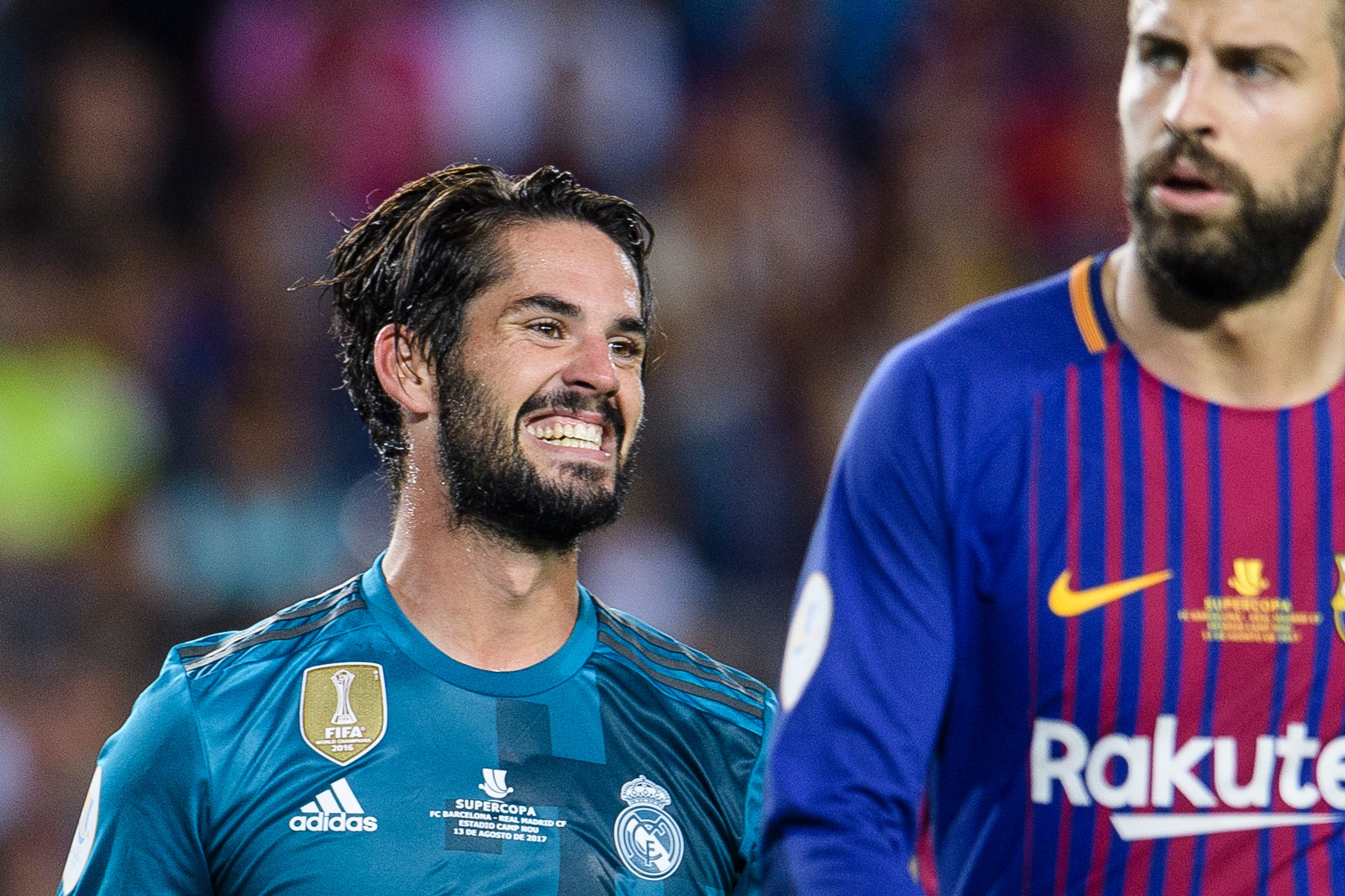 BARCELONA, SPAIN - AUGUST 13: Isco Alarcon of Real Madrid (L) and Gerard Pique Bernabeu of FC Barcelona (R) during the Supercopa de Espana Final 1st Leg match between FC Barcelona and Real Madrid at Camp Nou on August 13, 2017 in Barcelona, Spain. (Photo 