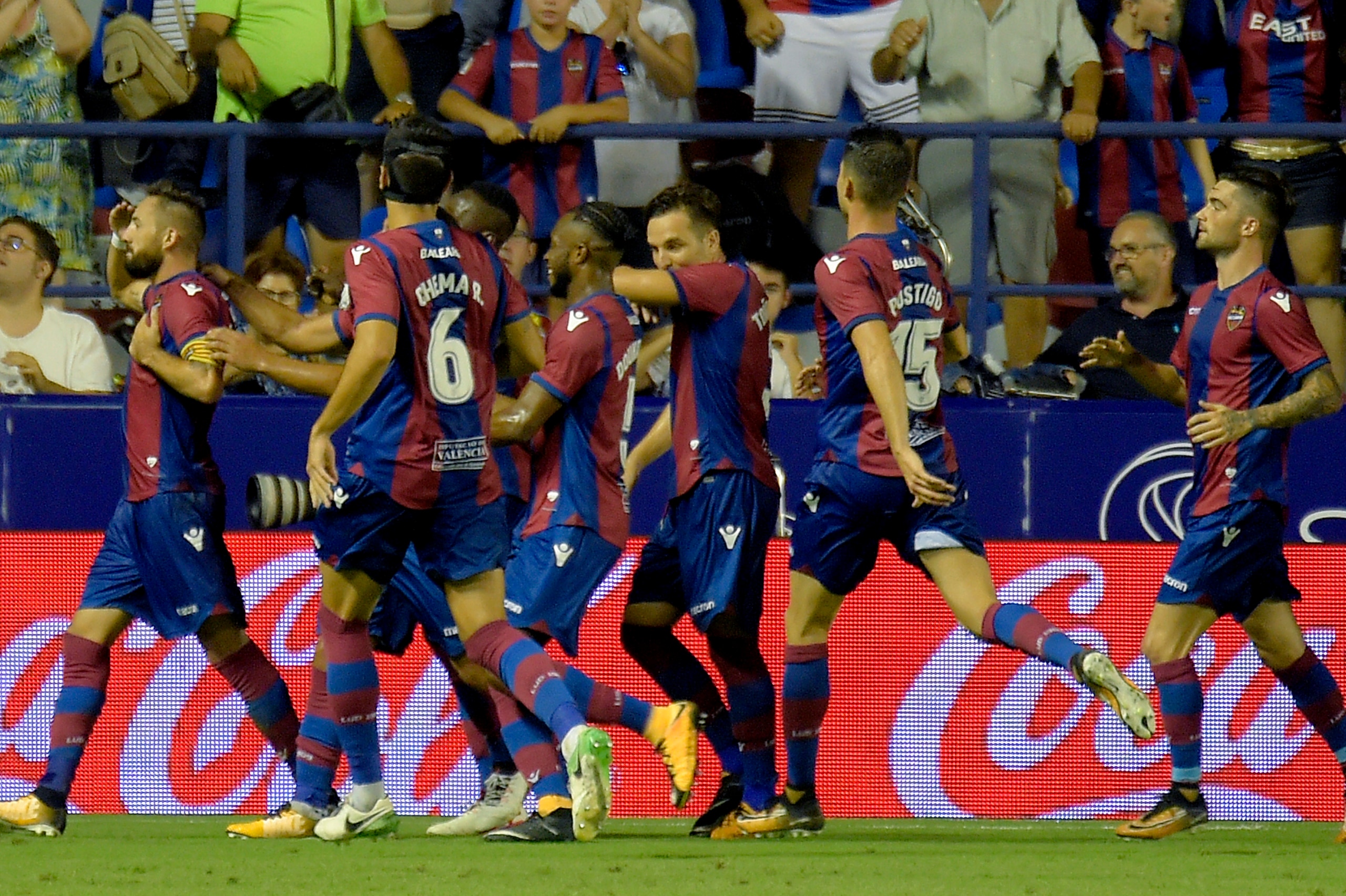 Levante's midfielder Jose Luis Morales (L) celebrates after scoring during the Spanish league footbal match Levante UD vs Villarreal CF at the Ciutat de Valencia stadium in Valencia on August 21, 2017. / AFP PHOTO / JOSE JORDAN        (Photo credit should