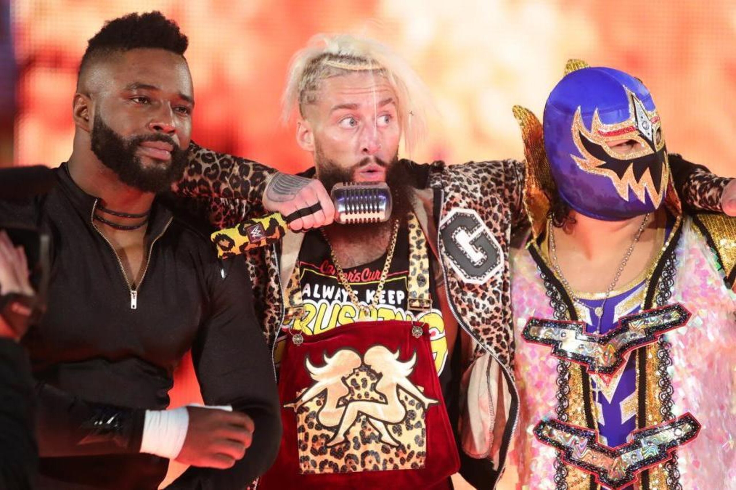 Cedric Alexander and Gran Metallik stand alongside Enzo Amore before their six-man tag match.