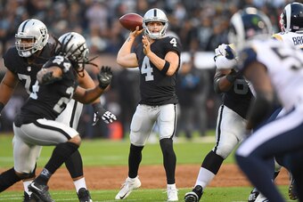 OAKLAND, CA - AUGUST 19:  Derek Carr #4 of the Oakland Raiders looks to throw a pass against the Los Angeles Rams during the first quarter of their preseason NFL football game at Oakland-Alameda County Coliseum on August 19, 2017 in Oakland, California.  