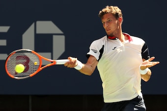 NEW YORK, NY - SEPTEMBER 05:  Pablo Carreno Busta of Spain returns a shot against Diego Schwartzman of Argentina during his Men's Singles Quarterfinal match on Day Nine of the 2017 US Open at the USTA Billie Jean King National Tennis Center on September 5