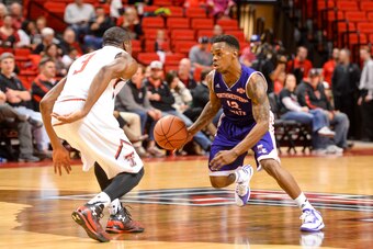 LUBBOCK, TX - NOVEMBER 25: Jalan West #12 of the Northwestern State Demons is guarded by Randy Onwuasor #3 of the Texas Tech Red Raiders during game action on November 25, 2014 at United Supermarkets Arena in Lubbock, Texas. Texas Tech won the game 75-64.