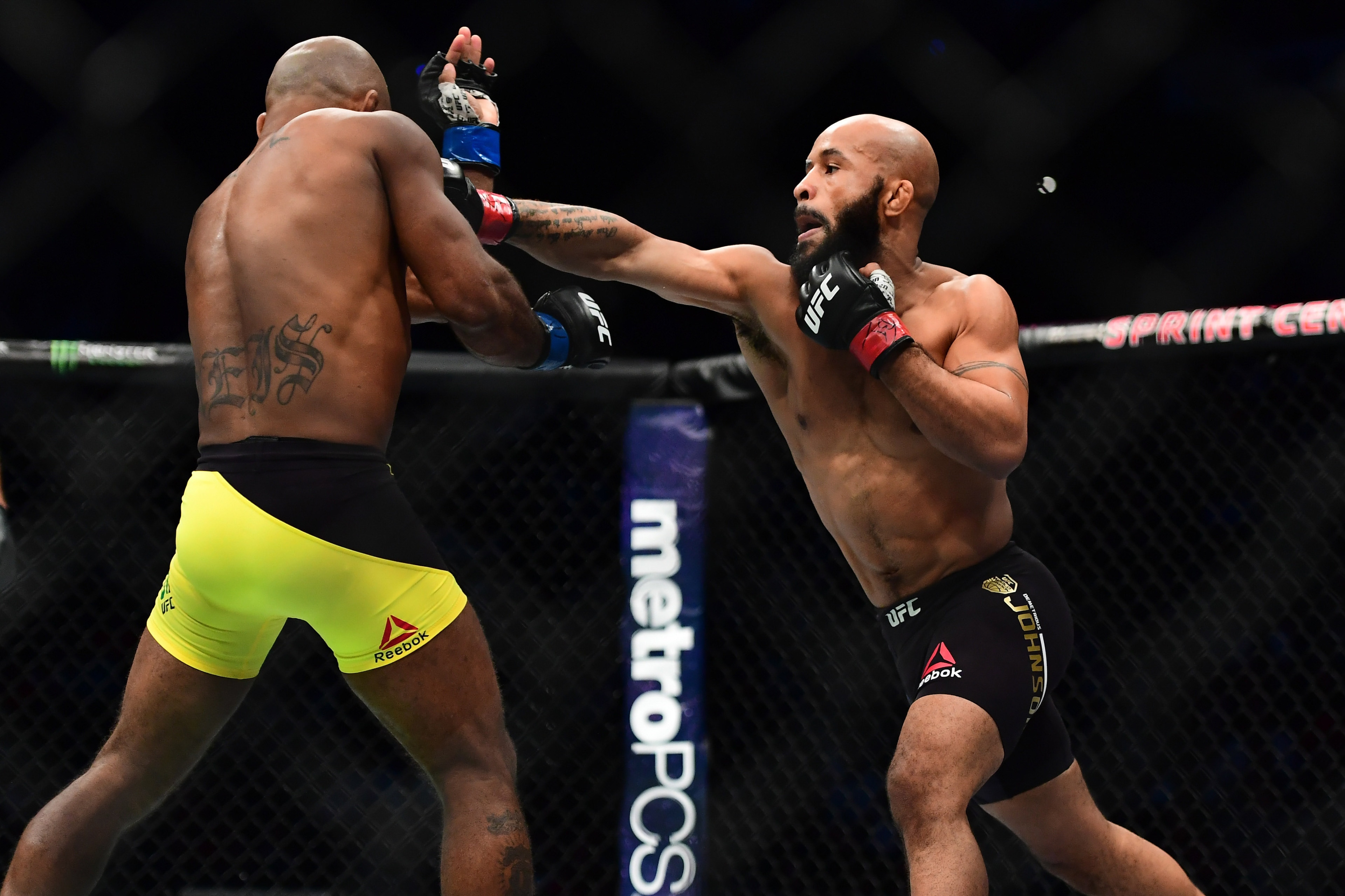Apr 15, 2017; Kansas City, MO, USA; Demetrious Johnson (red) and Wilson Reis (blue) fight during UFC Fight Night at Sprint Center. Mandatory Credit: Ron Chenoy-USA TODAY Sports Apr 15, 2017; Kansas City, MO, USA; Demetrious Johnson (red) and Wilson Reis (blue) fight during UFC Fight Night at Sprint Center. Mandatory Credit: Ron Chenoy-USA TODAY Sports