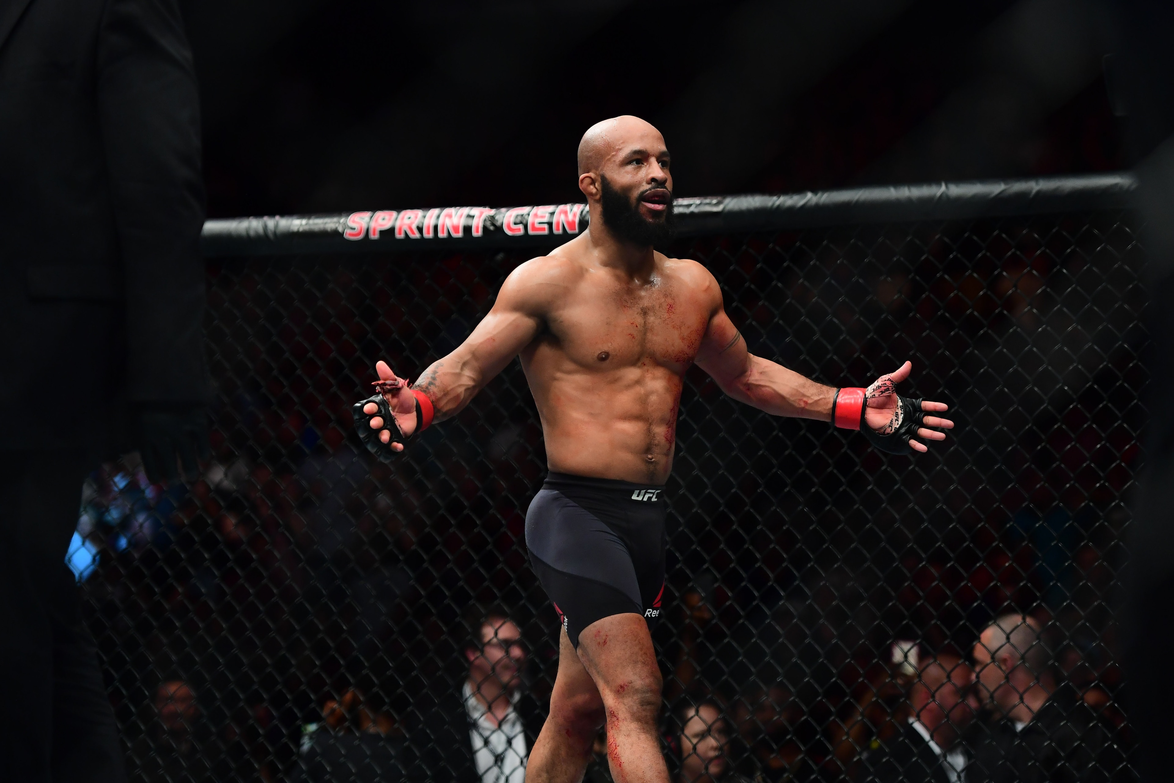 2Apr 15, 2017; Kansas City, MO, USA; Demetrious Johnson (red) celebrates following the win over and Wilson Reis (not pictured) during UFC Fight Night at Sprint Center. Mandatory Credit: Ron Chenoy-USA TODAY Sports 2Apr 15, 2017; Kansas City, MO, USA; Demetrious Johnson (red) celebrates following the win over and Wilson Reis (not pictured) during UFC Fight Night at Sprint Center. Mandatory Credit: Ron Chenoy-USA TODAY Sports