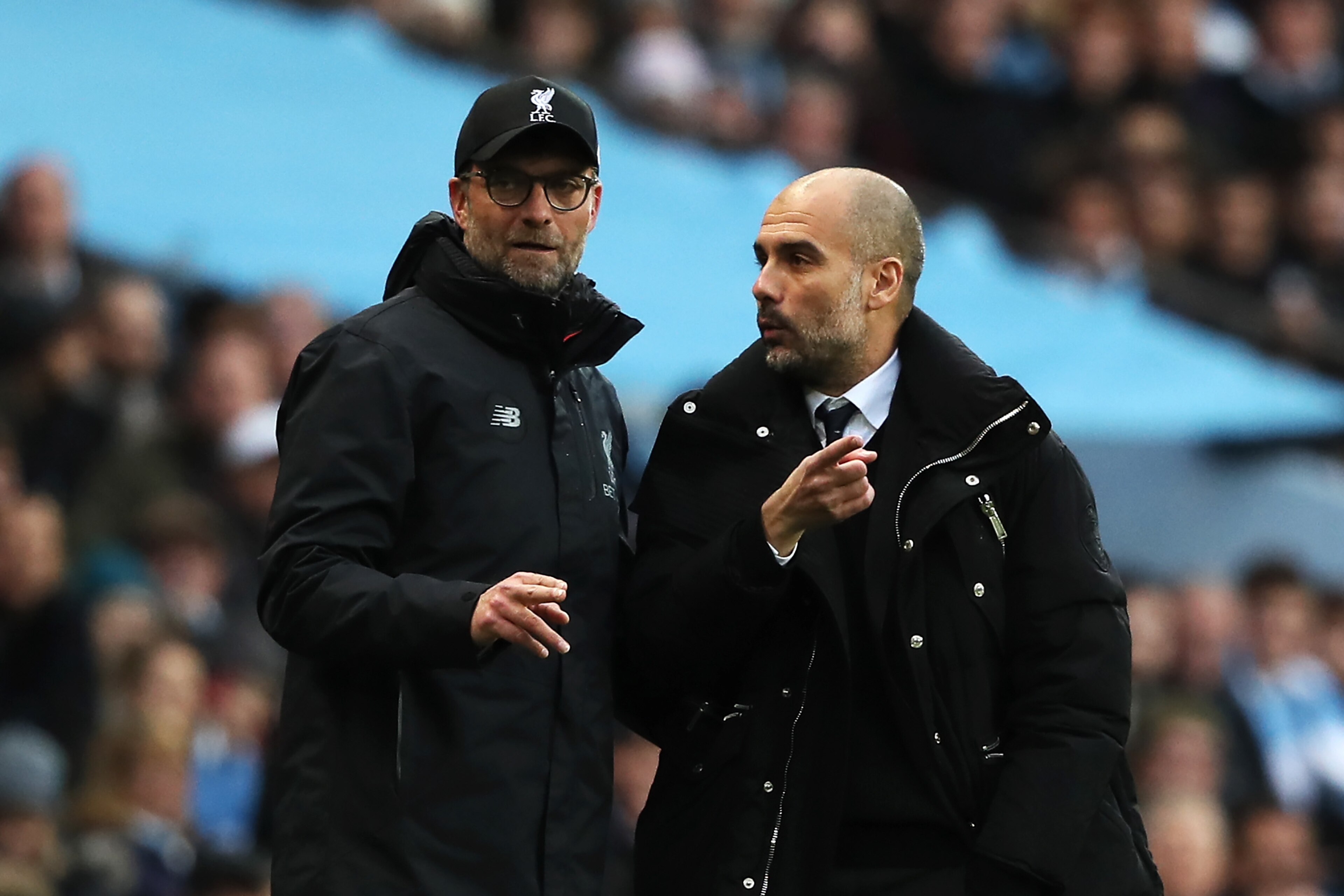 MANCHESTER, ENGLAND - MARCH 19:  Liverpool Manager / Head Coach Jurgen Klopp (L) exchanges views with Manchester City Manager / Head Coach Josep Guardiola during the Premier League match between Manchester City and Liverpool at Etihad Stadium on March 19,