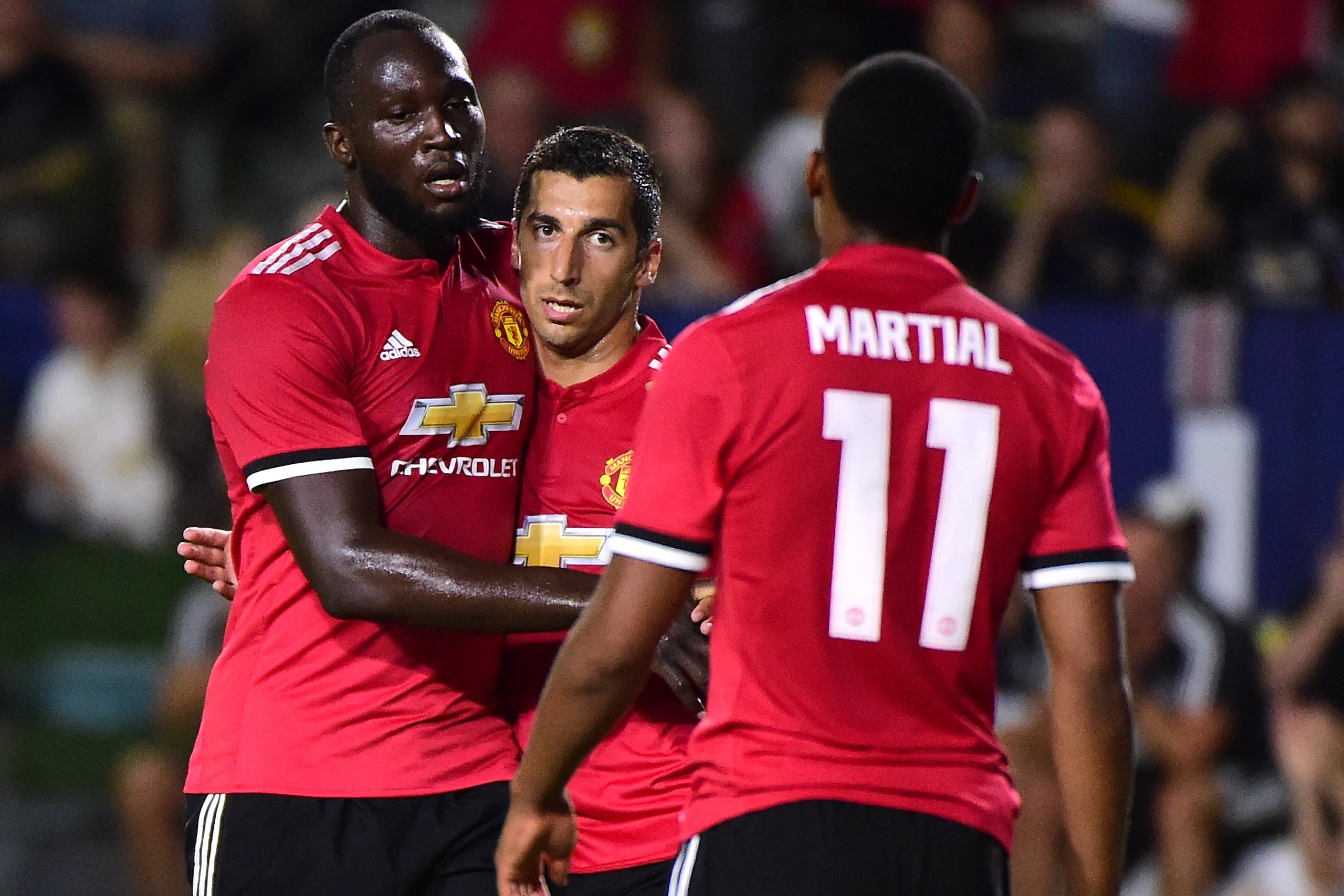 CARSON, CA - JULY 15:  Henrikh Mkhitaryan #22 of Manchester United celebrates his goal with Romelo Lukaku #9 and Anthony Martial #11 to take a 4-0 lead over the Los Angeles Galaxy during the second half at StubHub Center on July 15, 2017 in Carson, Califo
