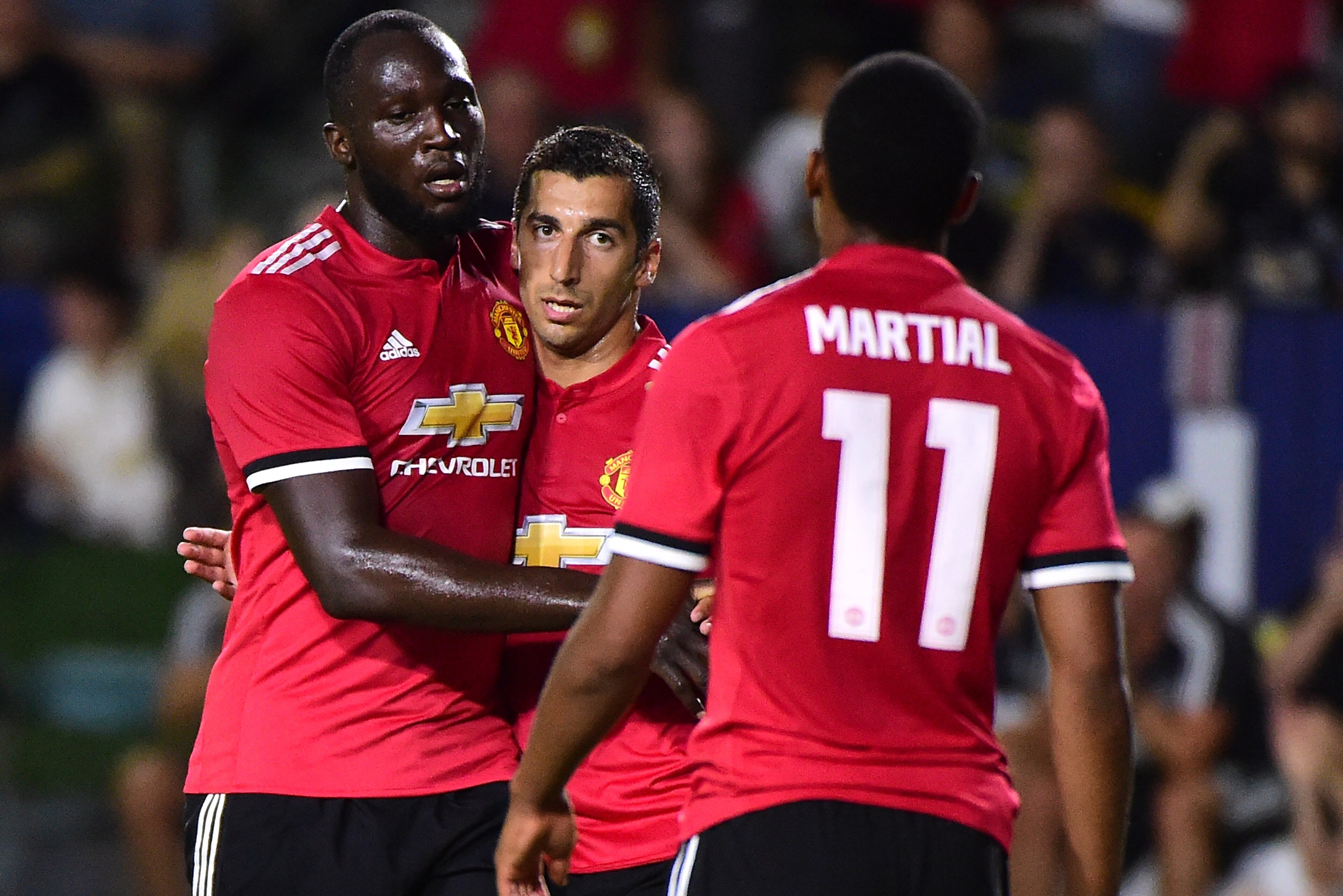 CARSON, CA - JULY 15:  Henrikh Mkhitaryan #22 of Manchester United celebrates his goal with Romelo Lukaku #9 and Anthony Martial #11 to take a 4-0 lead over the Los Angeles Galaxy during the second half at StubHub Center on July 15, 2017 in Carson, Califo