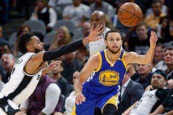 SAN ANTONIO,TX - MARCH 29:  Patty Mills #8 of the San Antonio Spurs tries to steal the ball from Stephen Curry #30 of the Golden State Warriors at AT&T Center on March 29, 2017 in San Antonio, Texas.  NOTE TO USER: User expressly acknowledges and agrees t