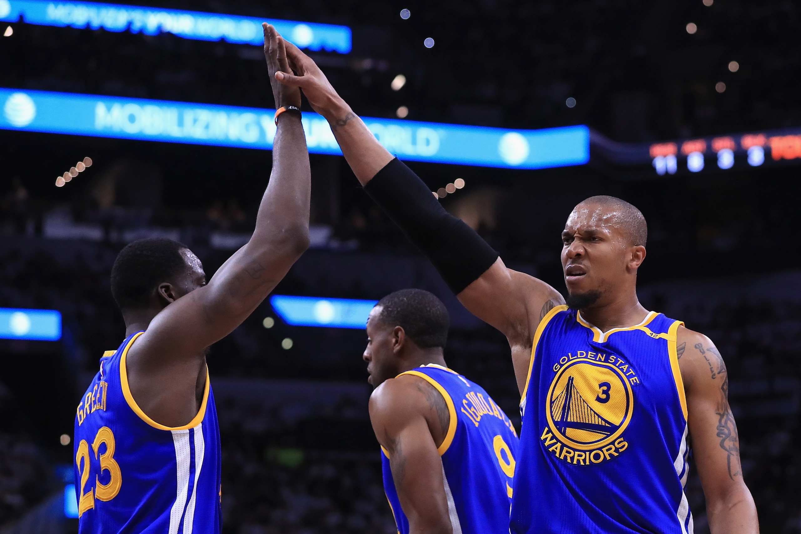 SAN ANTONIO, TX - MAY 20:  David West #3 of the Golden State Warriors high fives Draymond Green #23 in the first half against the San Antonio Spurs during Game Three of the 2017 NBA Western Conference Finals at AT&T Center on May 20, 2017 in San Antonio, 
