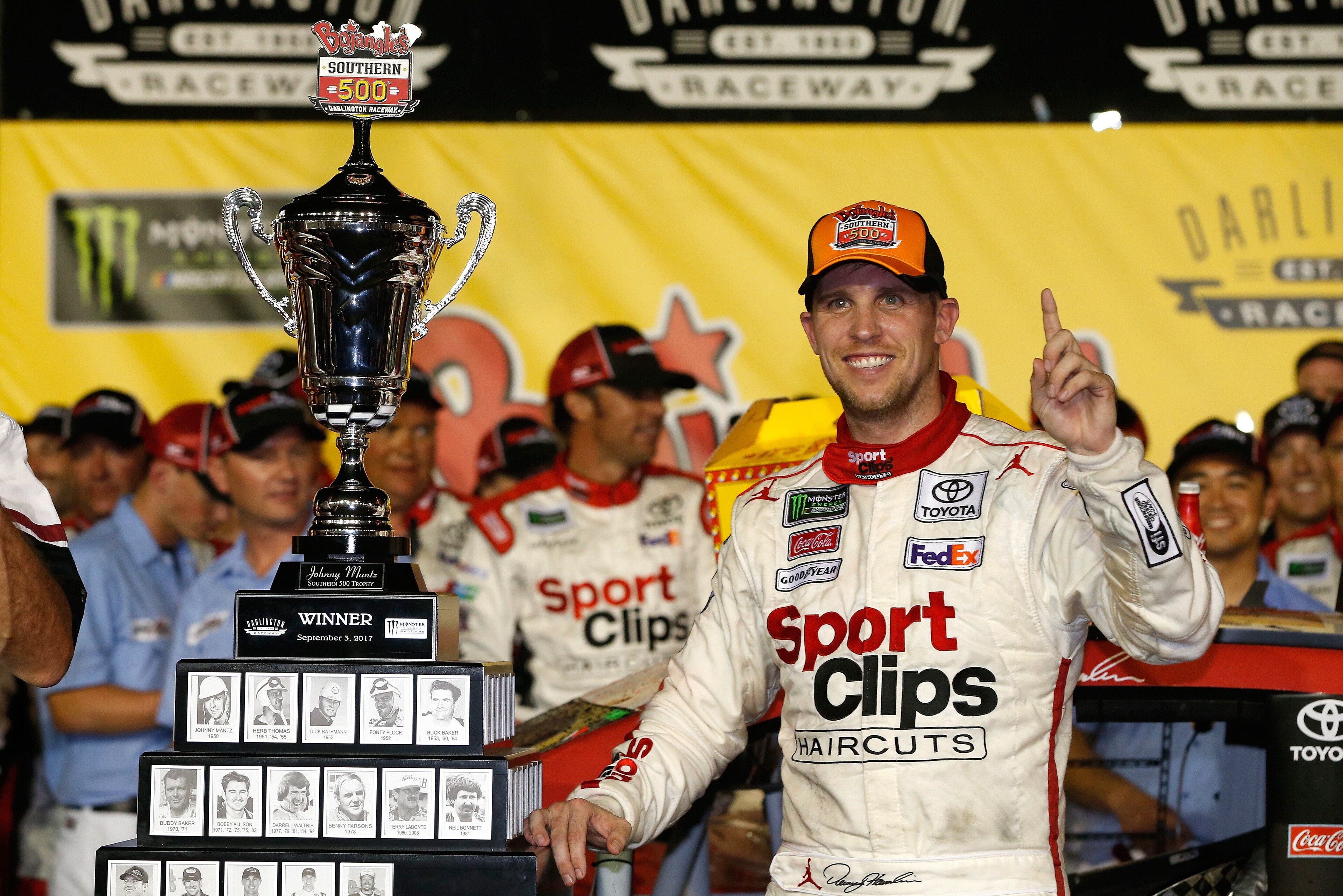 DARLINGTON, SC - SEPTEMBER 03:  Denny Hamlin, driver of the #11 Sport Clips Toyota, poses with the trophy in Victory Lane after winning the Monster Energy NASCAR Cup Series Bojangles' Southern 500 at Darlington Raceway on September 3, 2017 in Darlington, 
