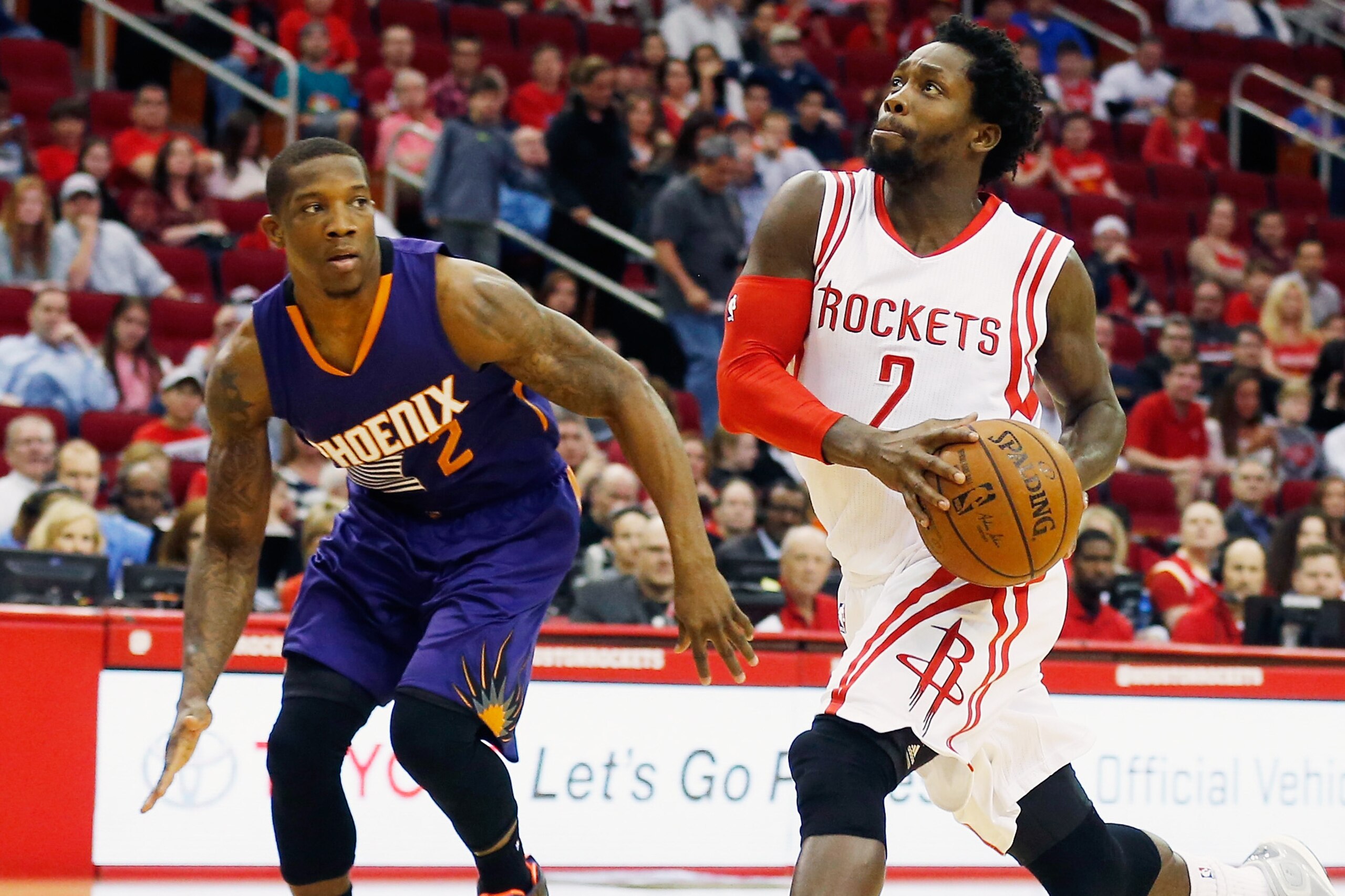 HOUSTON, TX - MARCH 21:  Patrick Beverley #2 of the Houston Rockets takes the basketball up the court in front of Eric Bledsoe #2 of the Phoenix Suns during their game against the Phoenix Sunsat the Toyota Center on March 21, 2015 in Houston, Texas. NOTE 