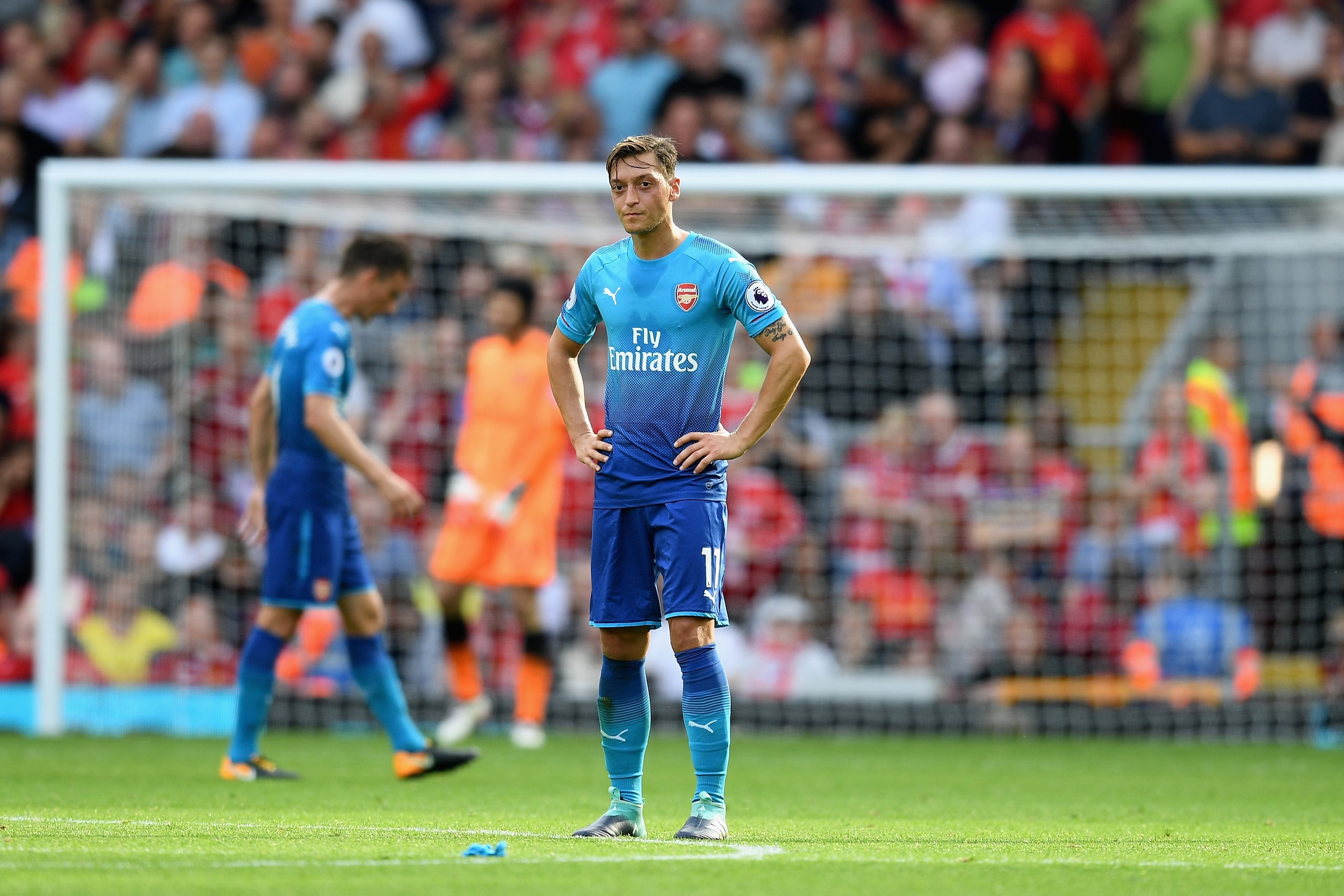 LIVERPOOL, ENGLAND - AUGUST 27:  Mesut Ozil of Arsenal is dejected after Liverpool's fourth goal during the Premier League match between Liverpool and Arsenal at Anfield on August 27, 2017 in Liverpool, England.  (Photo by Michael Regan/Getty Images)