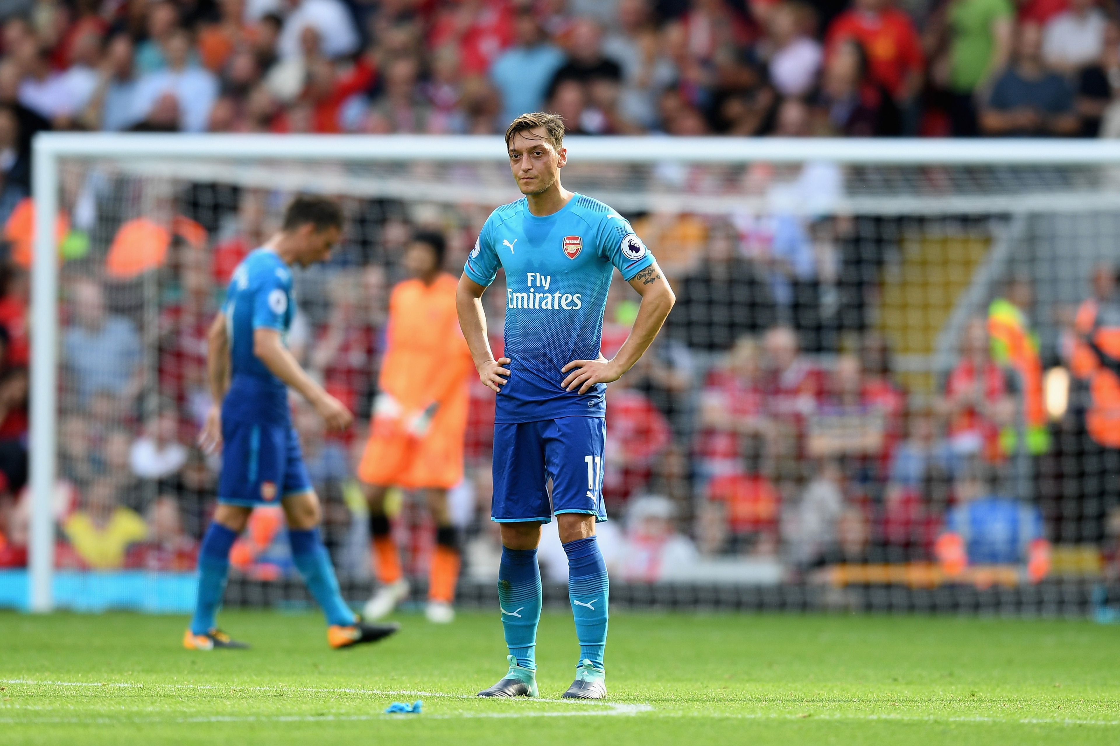 LIVERPOOL, ENGLAND - AUGUST 27:  Mesut Ozil of Arsenal is dejected after Liverpool's fourth goal during the Premier League match between Liverpool and Arsenal at Anfield on August 27, 2017 in Liverpool, England.  (Photo by Michael Regan/Getty Images)