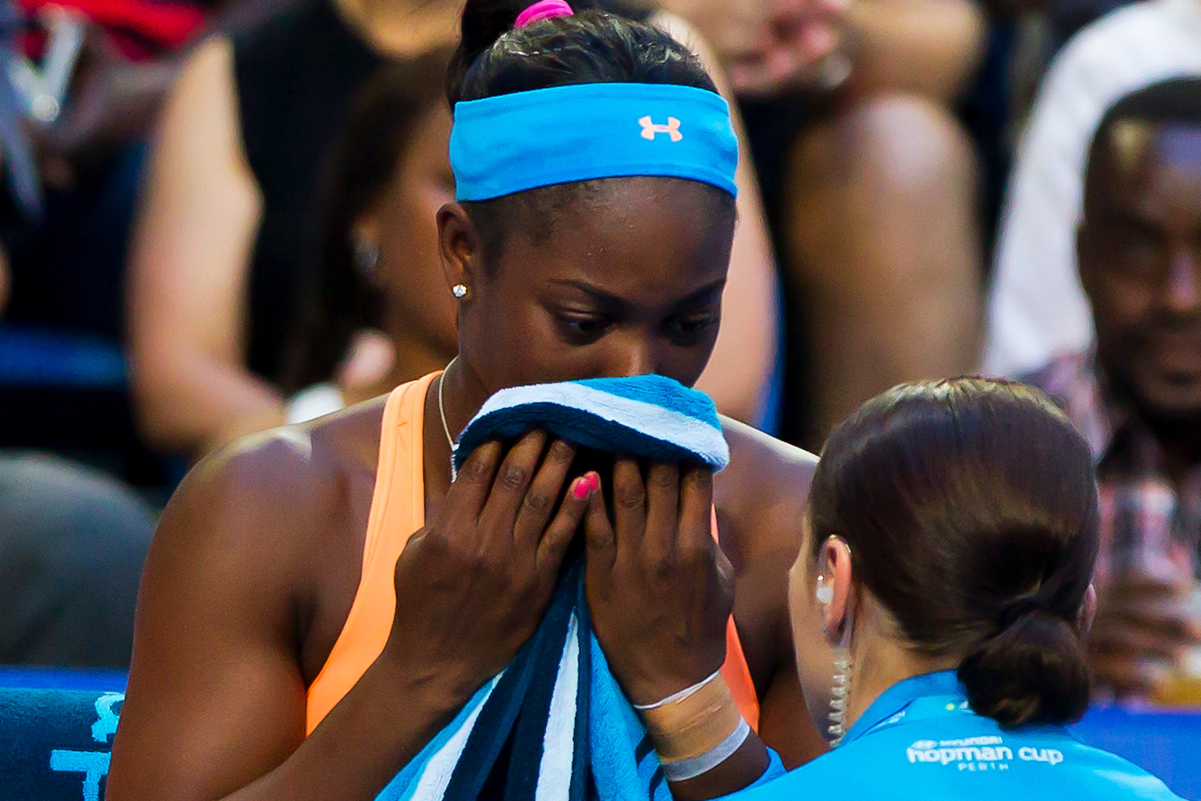 Sloane Stephens of the US receives medical attention and retires with a wrist injury competing against Petra Kvitova of the Czech Republic during their twelth session women's singles match on day seven of the Hopman Cup tennis tournament in Perth on Janua