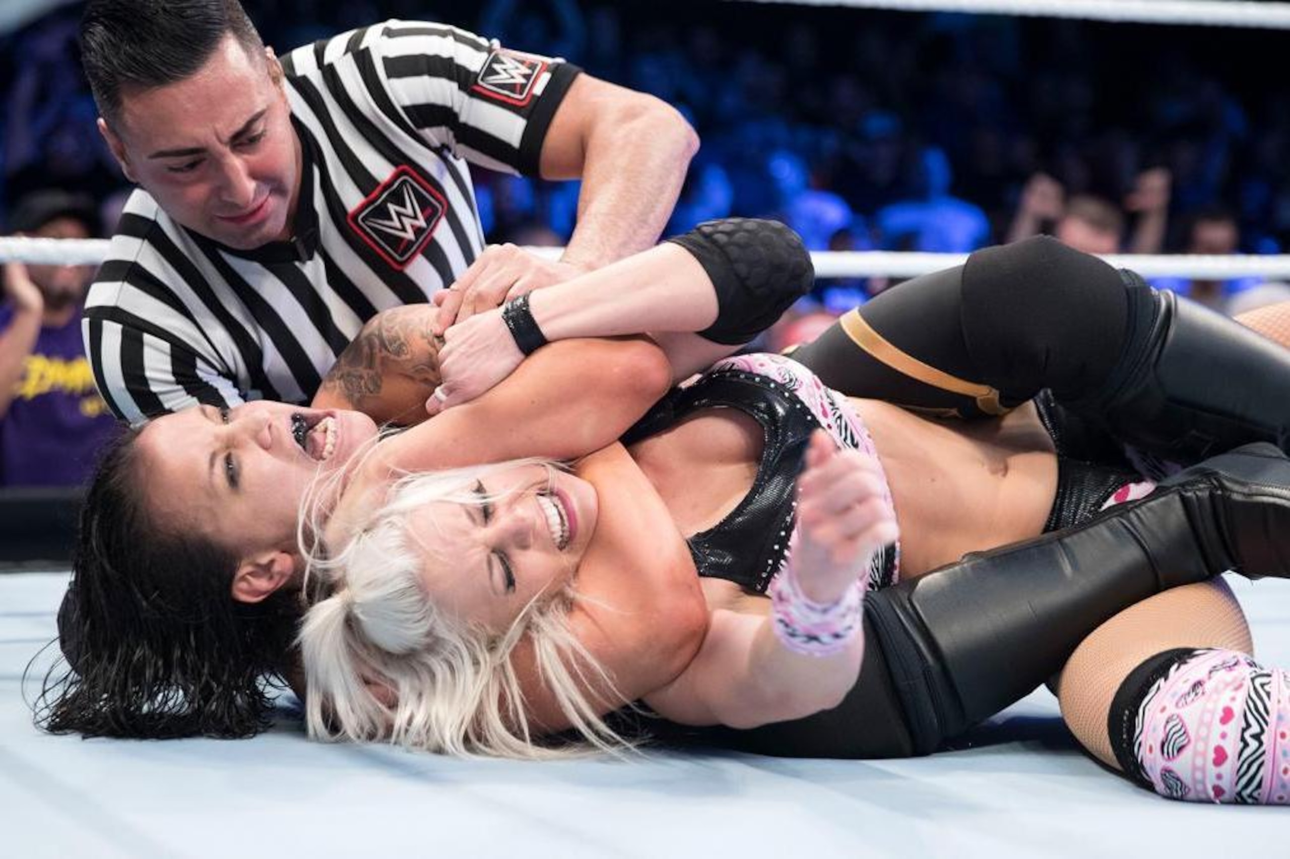 Shayna Baszler traps Candice LeRae in a rear naked choke. Shayna Baszler traps Candice LeRae in a rear naked choke.