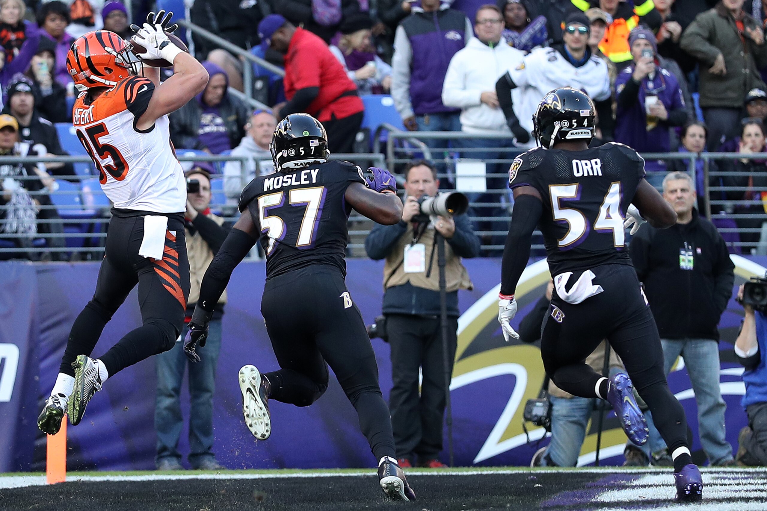 BALTIMORE, MD - NOVEMBER 27: Tight end Tyler Eifert #85 of the Cincinnati Bengals scores a third quarter touchdown past inside linebacker C.J. Mosley #57 and inside linebacker Zach Orr #54 of the Baltimore Ravens at M&T Bank Stadium on November 27, 2016 i