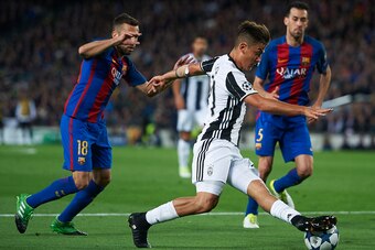 BARCELONA, SPAIN - APRIL 19:  Jordi Alba (L) of Barcelona competes for the ball with Paulo Dybala of Juventus during the UEFA Champions League Quarter Final second leg match between FC Barcelona and Juventus at Camp Nou on April 19, 2017 in Barcelona, Spa