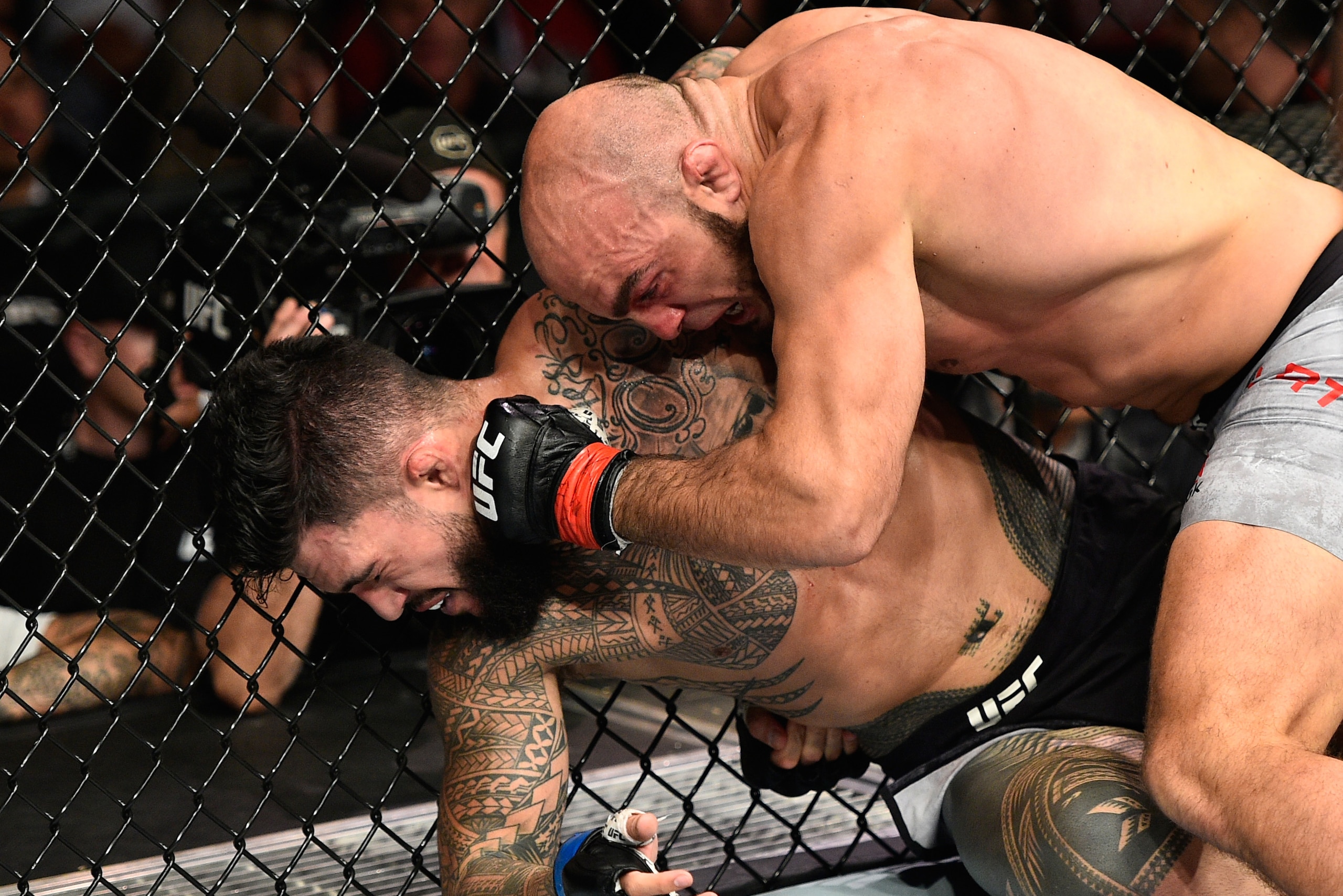 EDMONTON, AB - SEPTEMBER 09:  (R-L) Ilir Latifi of Sweden punches Tyson Pedro of Australia in their light heavyweight bout during the UFC 215 event inside the Rogers Place on September 9, 2017 in Edmonton, Alberta, Canada. (Photo by Jeff Bottari/Zuffa LLC