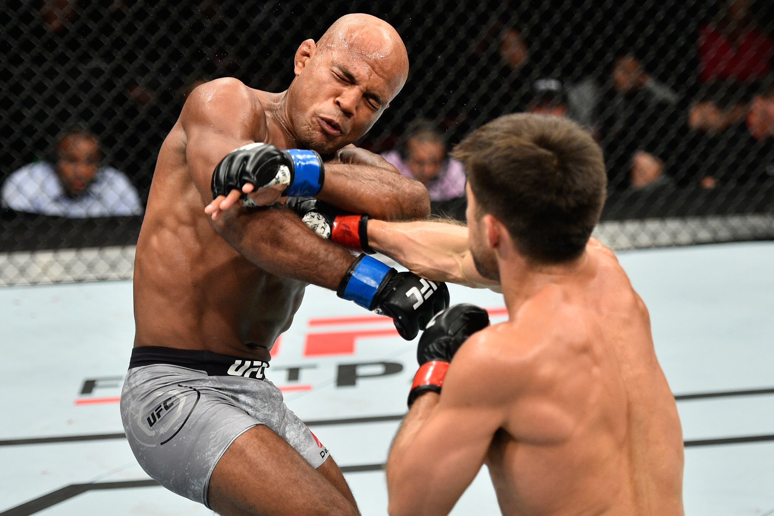 EDMONTON, AB - SEPTEMBER 09:  (R-L) Henry Cejudo punches Wilson Reis of Brazil in their flyweight bout during the UFC 215 event inside the Rogers Place on September 9, 2017 in Edmonton, Alberta, Canada. (Photo by Jeff Bottari/Zuffa LLC/Zuffa LLC via Getty