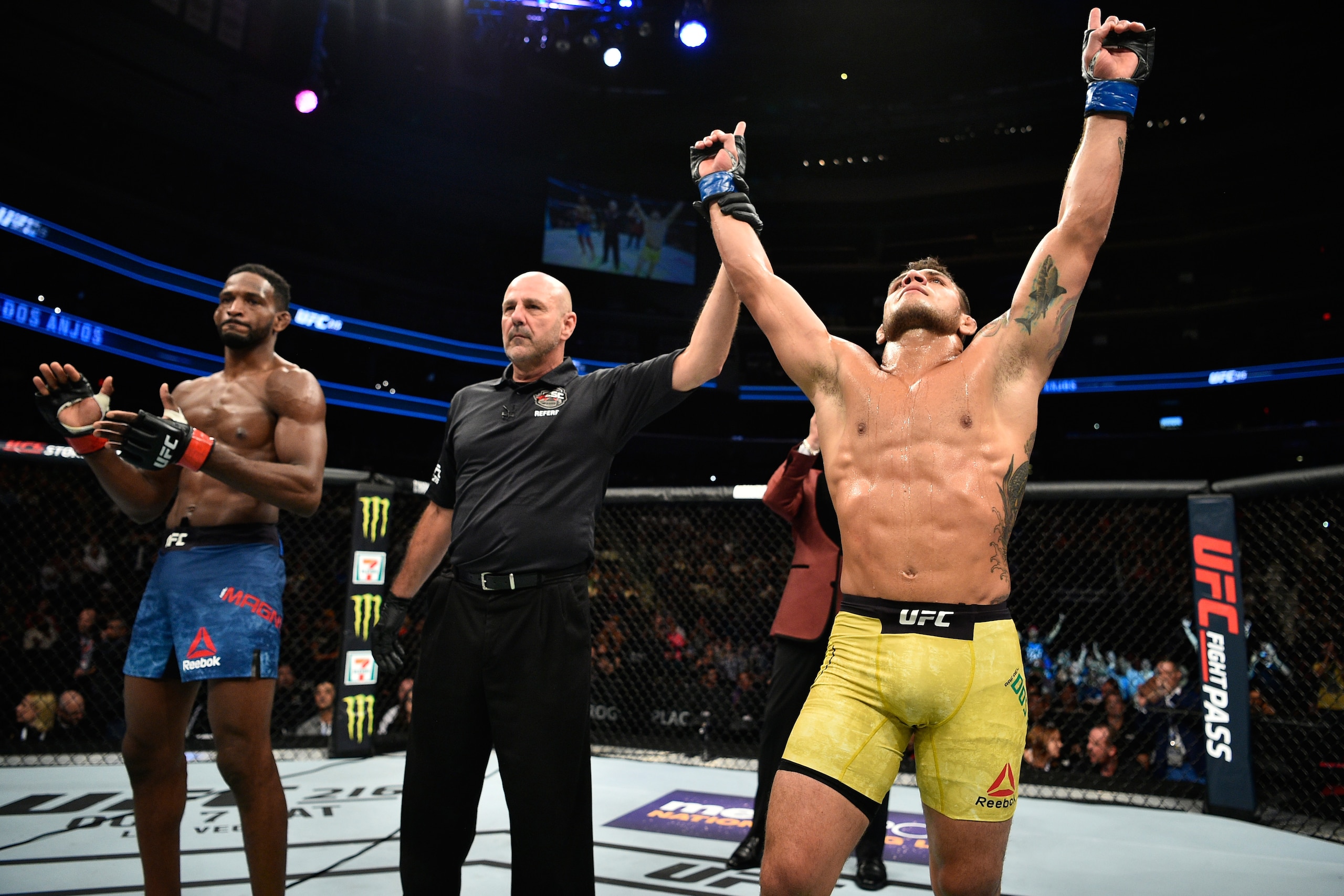 EDMONTON, AB - SEPTEMBER 09:  (R-L) Rafael Dos Anjos of Brazil celebrates his submission victory over Neil Magny in their welterweight bout during the UFC 215 event inside the Rogers Place on September 9, 2017 in Edmonton, Alberta, Canada. (Photo by Jeff 