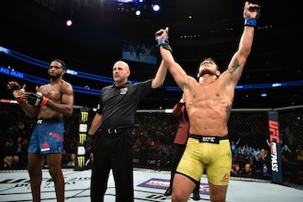 EDMONTON, AB - SEPTEMBER 09: (R-L) Rafael Dos Anjos of Brazil celebrates his submission victory over Neil Magny in their welterweight bout during the UFC 215 event inside the Rogers Place on September 9, 2017 in Edmonton, Alberta, Canada. (Photo by Jeff EDMONTON, AB - SEPTEMBER 09: (R-L) Rafael Dos Anjos of Brazil celebrates his submission victory over Neil Magny in their welterweight bout during the UFC 215 event inside the Rogers Place on September 9, 2017 in Edmonton, Alberta, Canada. (Photo by Jeff