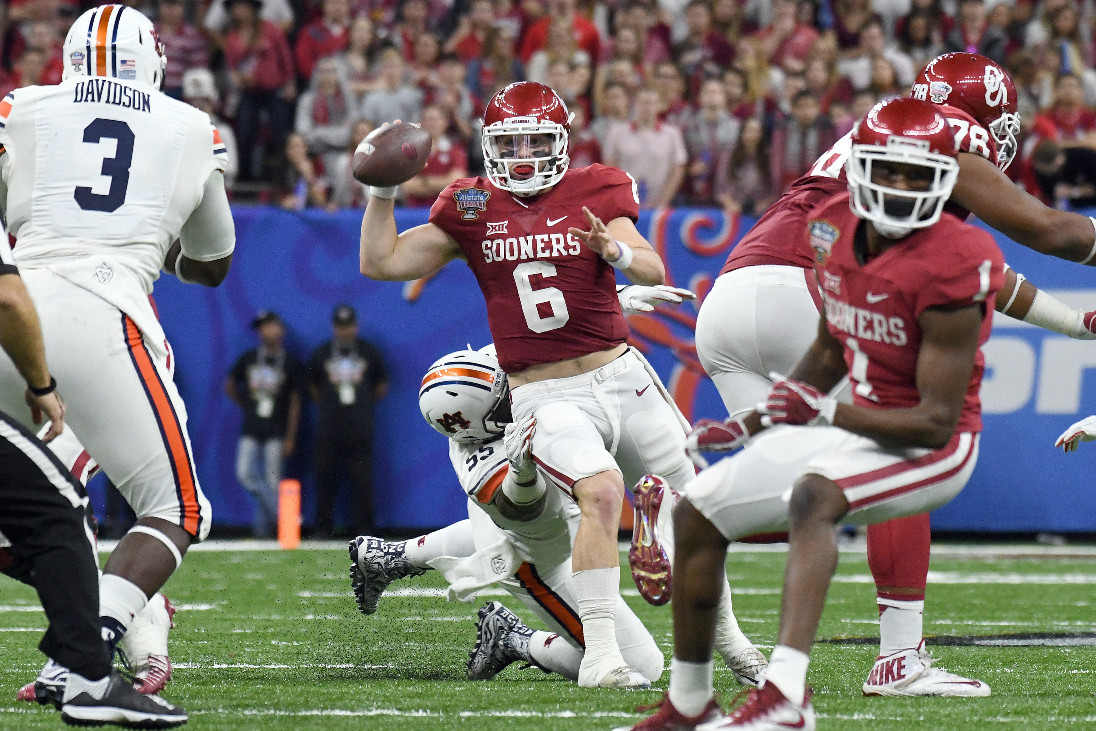 NEW ORLEANS, LA - JANUARY 02: Quarterback Baker Mayfield #6 of the Oklahoma Sooners throws a pass under pressure during their victory against the Auburn Tigers in the Sugar Bowl on January 2, 2017 at The Superdome in New Orleans, Louisiana. (Photo by Jack