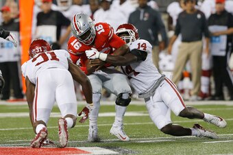 Sep 9, 2017; Columbus, OH, USA; Ohio State Buckeyes quarterback J.T. Barrett (16) is sacked by Oklahoma Sooners linebacker Emmanuel Beal (14) and teammate  Ogbonnia Okoronkwo (31) during the second quarter at Ohio Stadium. Mandatory Credit: Joe Maiorana-U