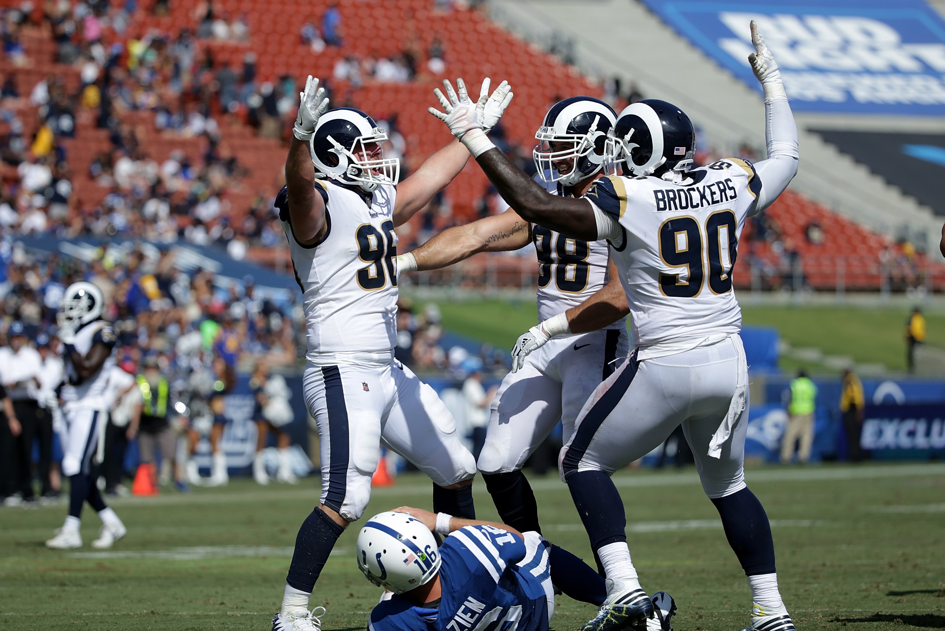LOS ANGELES, CA - SEPTEMBER 10:  Michael Brockers #90, Matt Longacre #96 and Connor Barwin #98 of the Los Angeles Rams celebrate after a sack against Scott Tolzien #16 of the Indianapolis Colts during the third quarter at the Los Angeles Memorial Coliseum