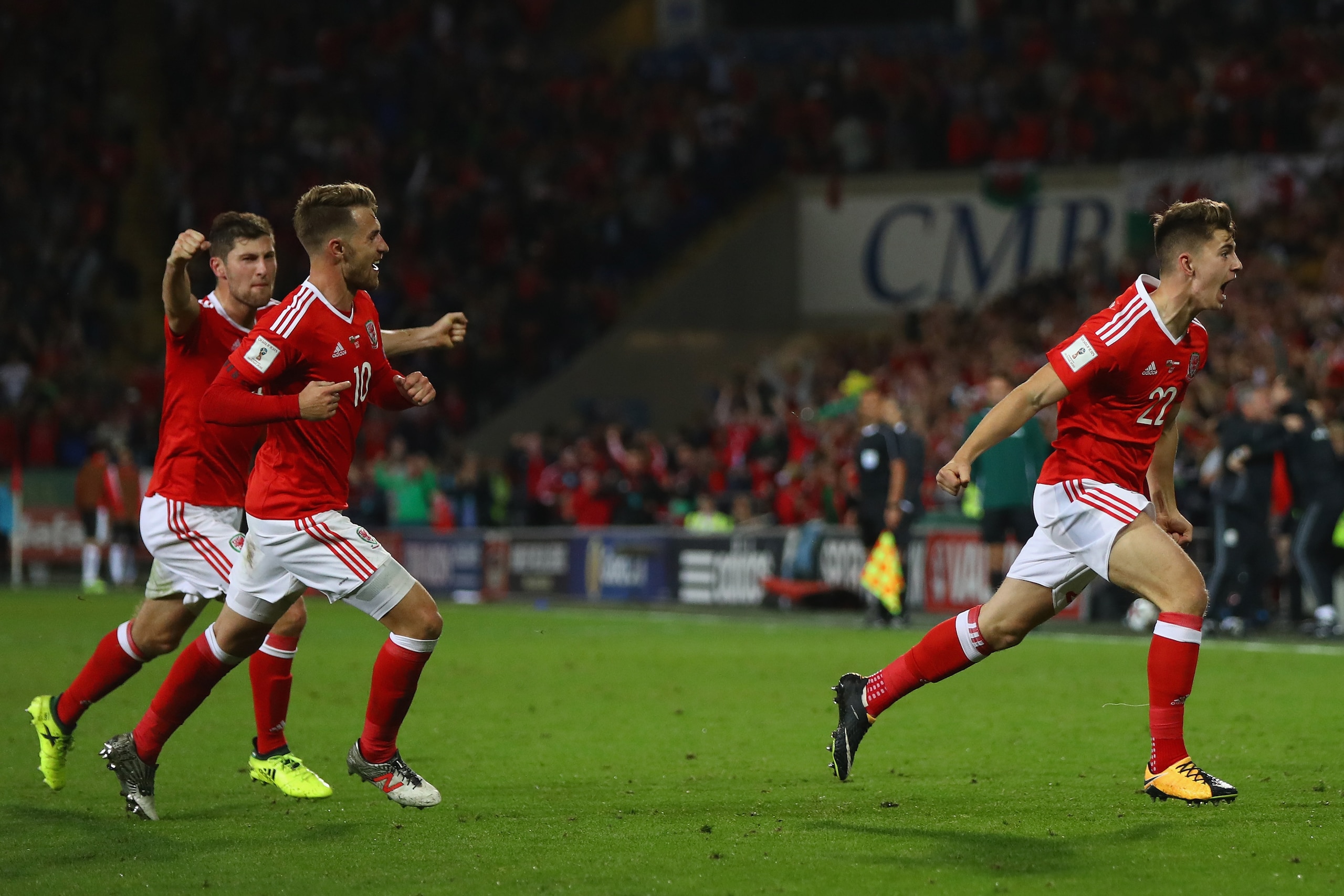 CARDIFF, WALES - SEPTEMBER 02:  Ben Woodburn (R) of Wales celebrates scoring the winning goal during the FIFA 2018 World Cup Qualifier Group D match between Wales and Austria at Cardiff City Stadium on September 2, 2017 in Cardiff, Wales.  (Photo by Micha