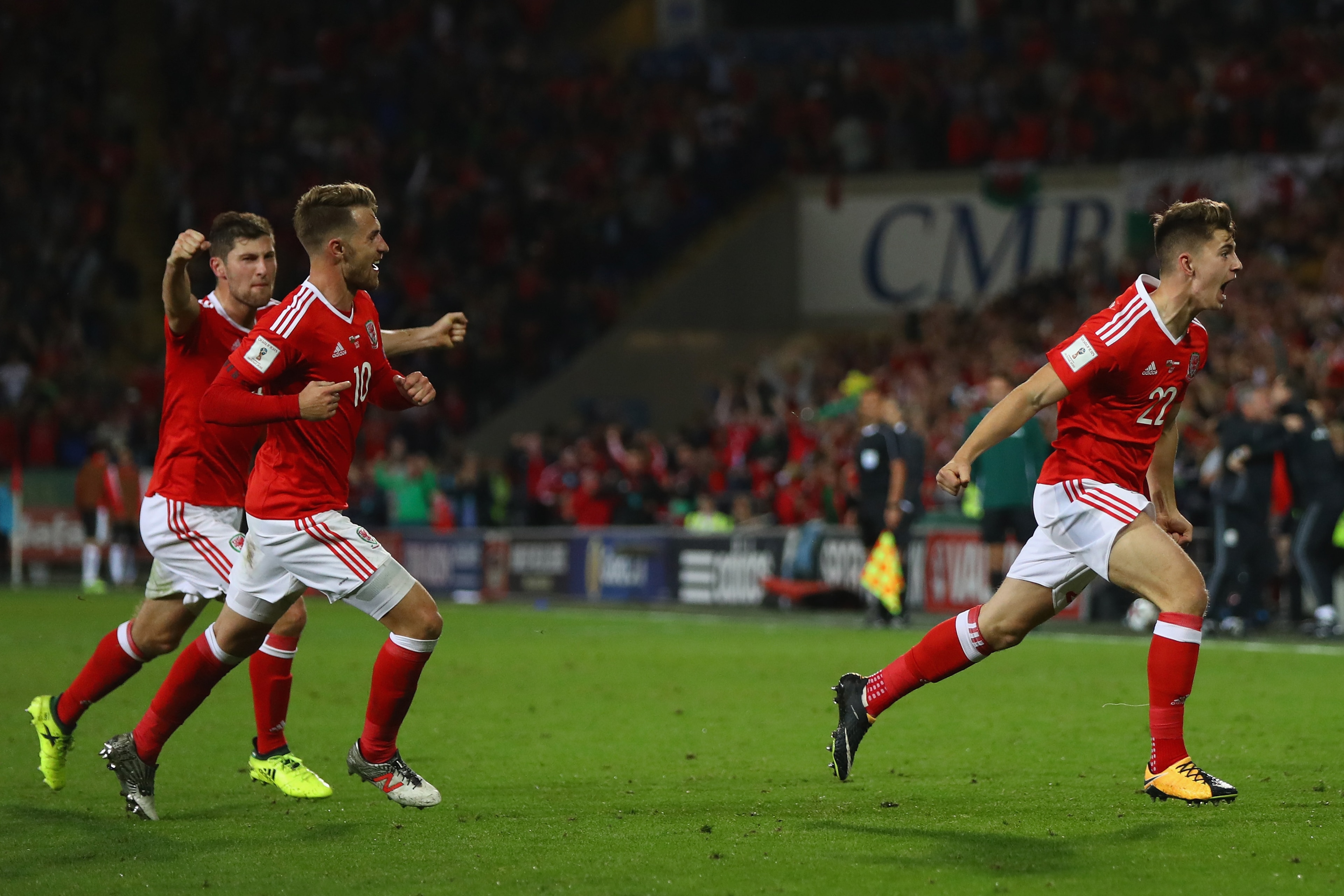 CARDIFF, WALES - SEPTEMBER 02:  Ben Woodburn (R) of Wales celebrates scoring the winning goal during the FIFA 2018 World Cup Qualifier Group D match between Wales and Austria at Cardiff City Stadium on September 2, 2017 in Cardiff, Wales.  (Photo by Micha