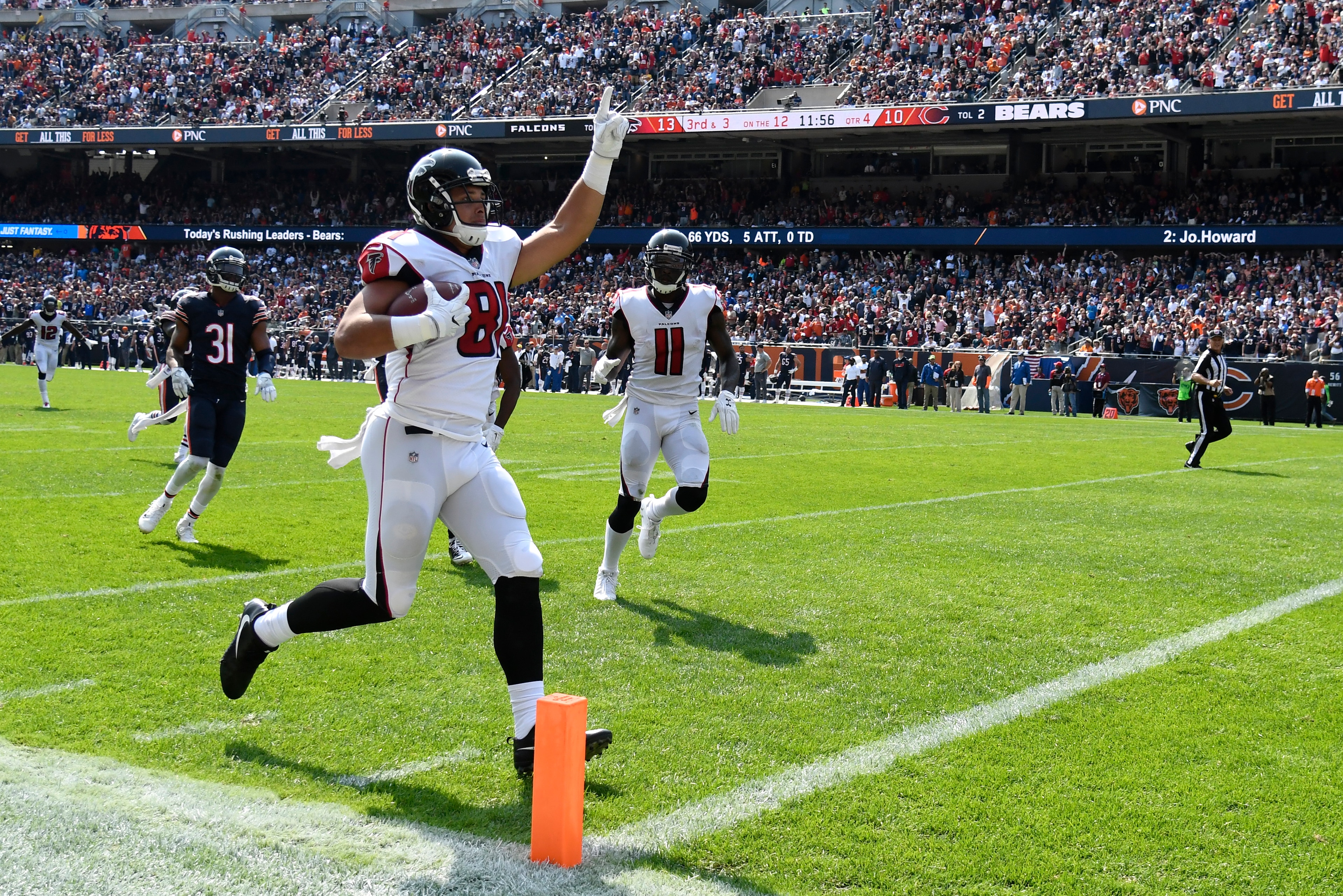 CHICAGO, IL - SEPTEMBER 10:   Austin Hooper #81 of the Atlanta Falcons runs the football in for a touchdown against the Chicago Bears in the fourth quarter at Soldier Field on September 10, 2017 in Chicago, Illinois.  (Photo by David Banks/Getty Images)
