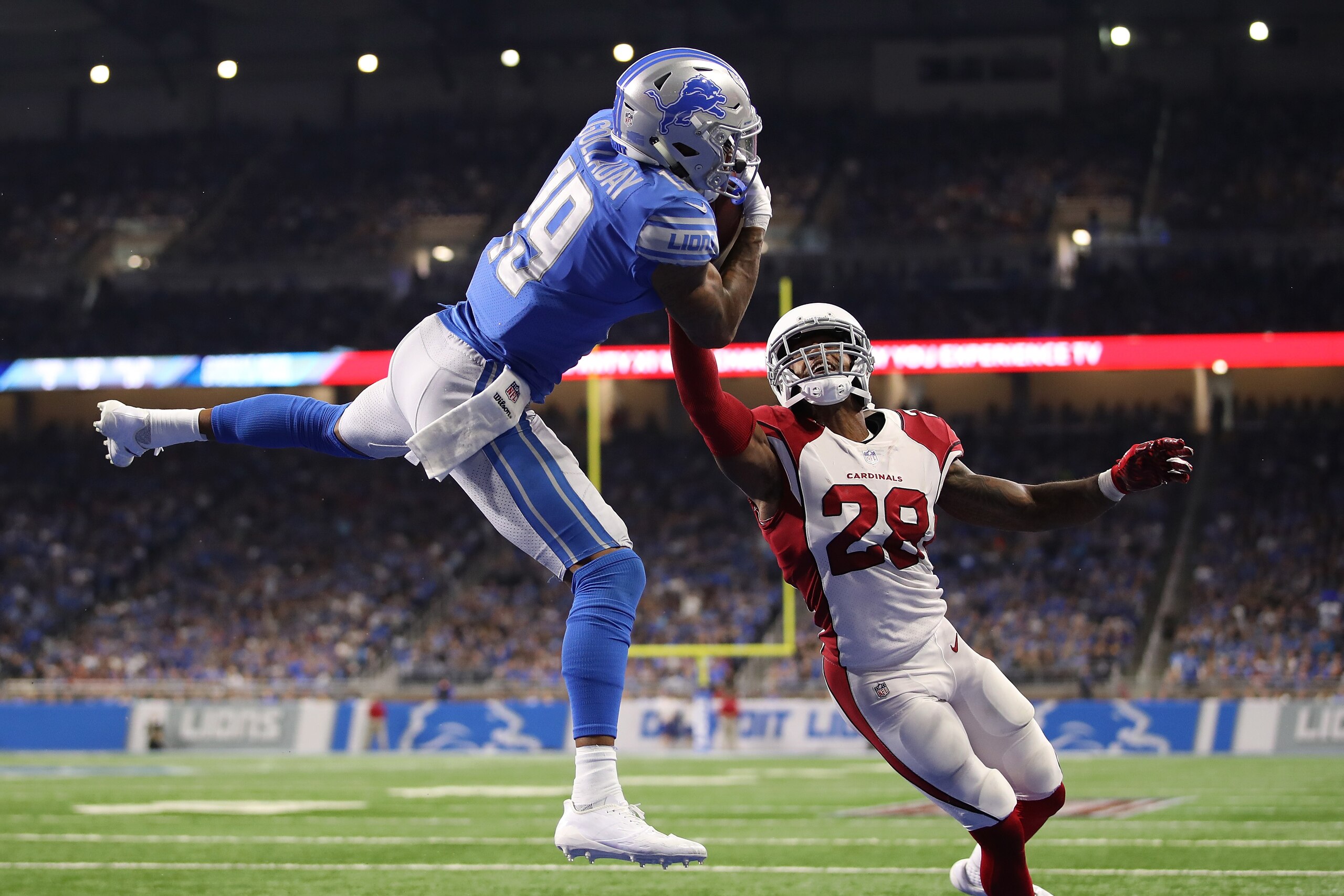 DETROIT, MI - SEPTEMBER 10: Kenny Golladay #19 of the Detroit Lions catches a fourth quarter touchdown next to Justin Bethel #28 of the Arizona Cardinals at Ford Field on September 10, 2017 in Detroit, Michigan. Detroit won the game 35-23. (Photo by Grego