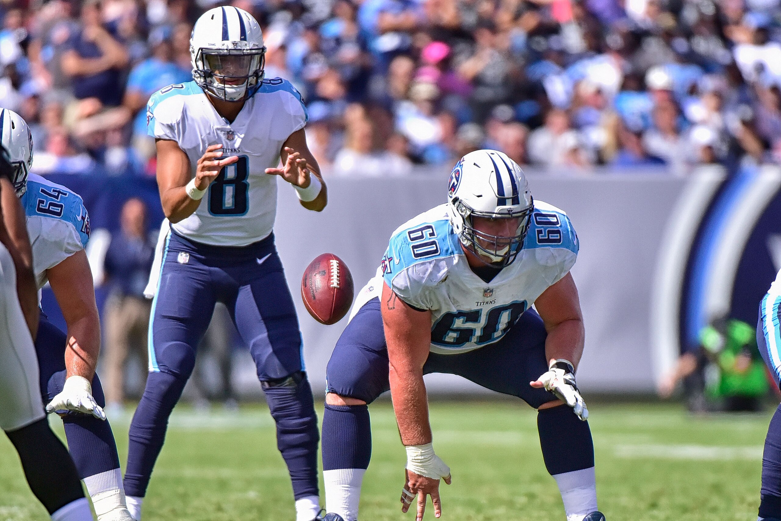 NASHVILLE, TN - SEPTEMBER 10:  Ben Jones #60 of the Tennessee Titans snaps to quarterback Marcus Mariota #8 during a game against the Oakland Raiders at Nissan Stadium on September 10, 2017 in Nashville, Tennessee.  (Photo by Frederick Breedon/Getty Image