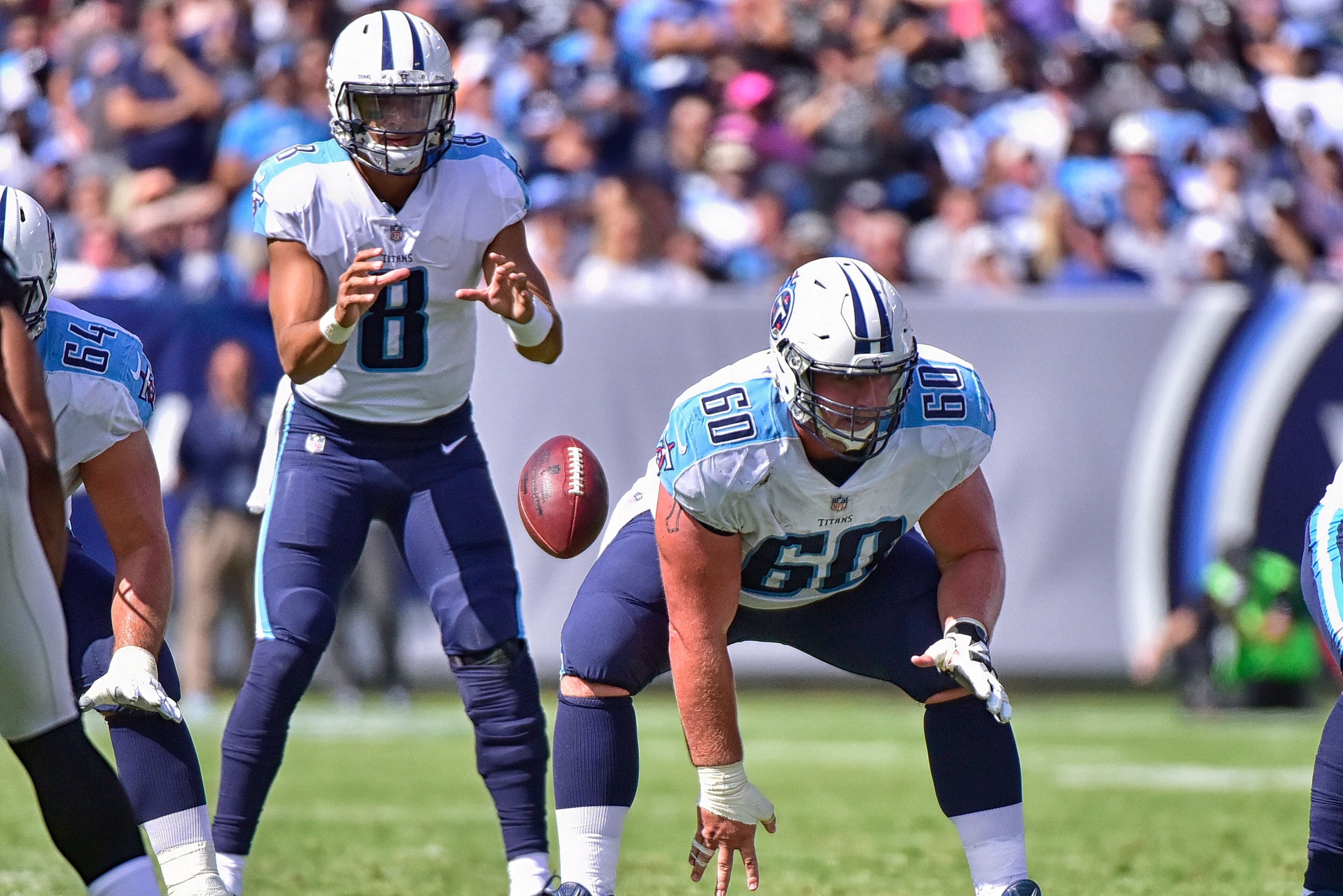 NASHVILLE, TN - SEPTEMBER 10:  Ben Jones #60 of the Tennessee Titans snaps to quarterback Marcus Mariota #8 during a game against the Oakland Raiders at Nissan Stadium on September 10, 2017 in Nashville, Tennessee.  (Photo by Frederick Breedon/Getty Image