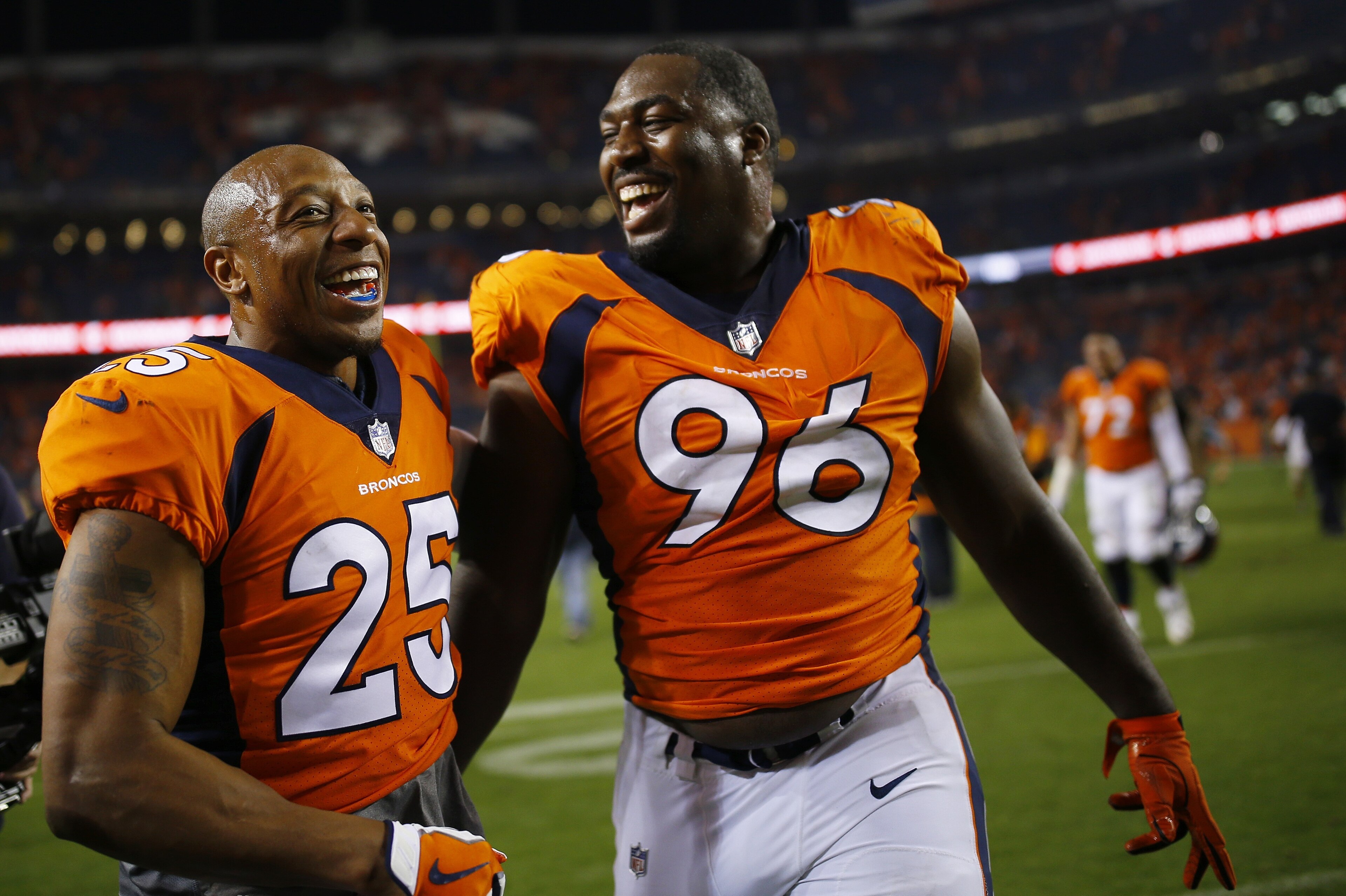DENVER, CO - SEPTEMBER 11:  Defensive end Shelby Harris #96 of the Denver Broncos celebrates winning the game with Chris Harris #25 against the Los Angeles Chargers at Sports Authority Field at Mile High on September 11, 2017 in Denver, Colorado. Harris b