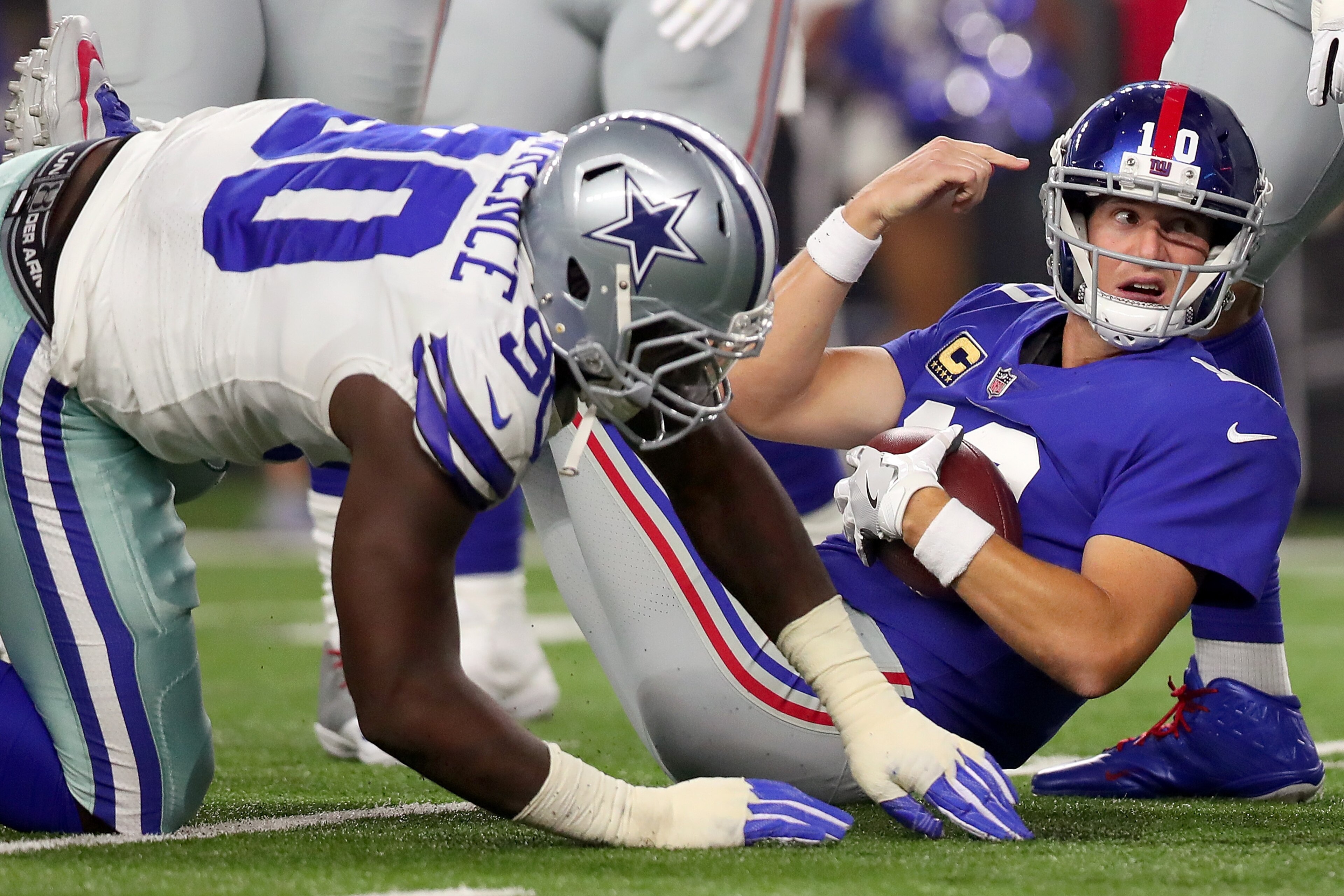 ARLINGTON, TX - SEPTEMBER 10: Eli Manning #10 of the New York Giants is sacked for a loss by Demarcus Lawrence #90 of the Dallas Cowboys in the first quarter at AT&T Stadium on September 10, 2017 in Arlington, Texas. (Photo by Tom Pennington/Getty Image ARLINGTON, TX - SEPTEMBER 10: Eli Manning #10 of the New York Giants is sacked for a loss by Demarcus Lawrence #90 of the Dallas Cowboys in the first quarter at AT&T Stadium on September 10, 2017 in Arlington, Texas. (Photo by Tom Pennington/Getty Image