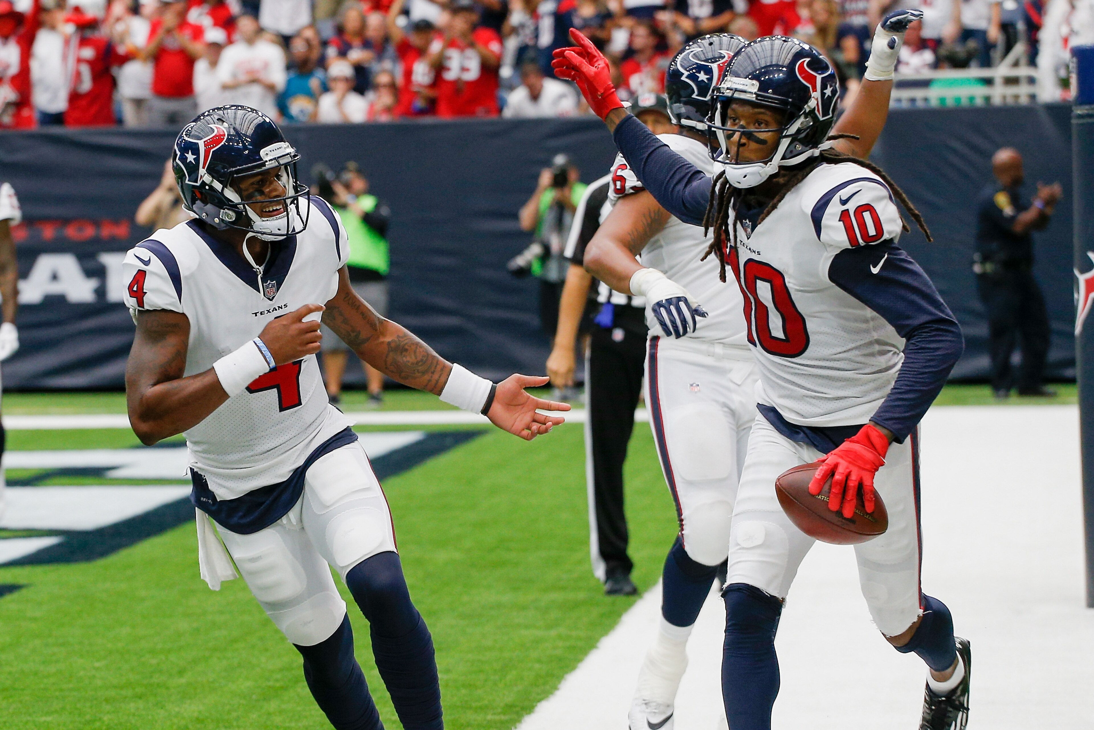 HOUSTON, TX - SEPTEMBER 10:  DeAndre Hopkins #10 of the Houston Texans and Deshaun Watson #4 celebrate after a score in the third quarter at NRG Stadium on September 10, 2017 in Houston, Texas.  (Photo by Bob Levey/Getty Images)