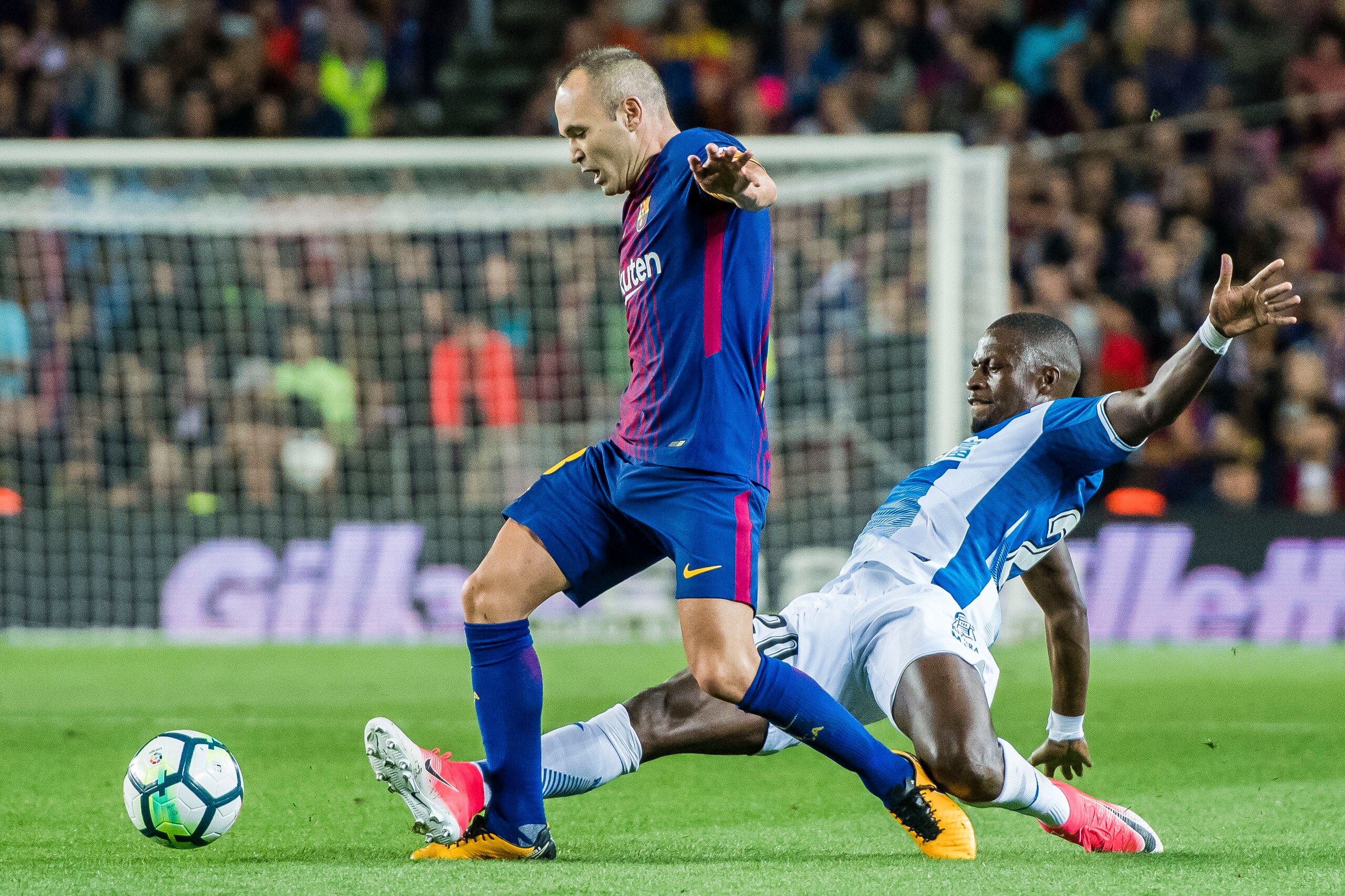 BARCELONA, SPAIN - SEPTEMBER 09: Andres Iniesta Lujan (L) of FC Barcelona fights for the ball with Papakouli Diop (R) of RCD Espanyol during the La Liga match between FC Barcelona vs RCD Espanyol at the Camp Nou on 09 September 2017 in Barcelona, Spain. ( BARCELONA, SPAIN - SEPTEMBER 09: Andres Iniesta Lujan (L) of FC Barcelona fights for the ball with Papakouli Diop (R) of RCD Espanyol during the La Liga match between FC Barcelona vs RCD Espanyol at the Camp Nou on 09 September 2017 in Barcelona, Spain. (