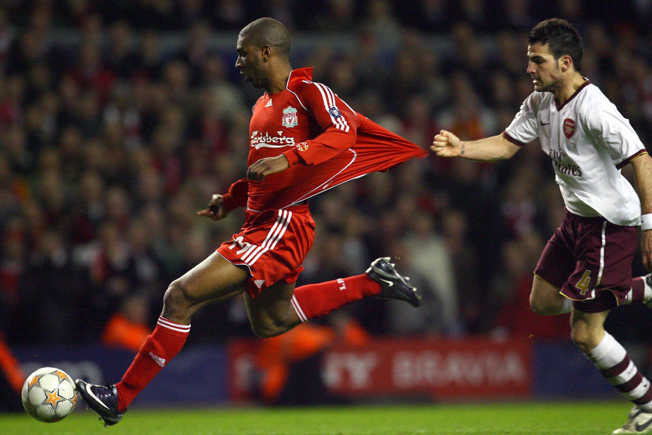 Liverpool's Dutch forward Ryan Babel (L) shrugs off Arsenal's Spanish midfielder Cesc Fabregas to score the fourth goal during their UEFA Champions League quater final second leg football match at Anfield, Liverpool, north-west England, on April 8, 2008. Liverpool's Dutch forward Ryan Babel (L) shrugs off Arsenal's Spanish midfielder Cesc Fabregas to score the fourth goal during their UEFA Champions League quater final second leg football match at Anfield, Liverpool, north-west England, on April 8, 2008.