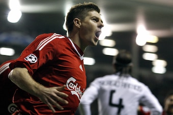 Liverpool's English midfielder Steven Gerrard celebrates after scoring the third goal against Real Madrid during their UEFA Champions League second round, second leg football match at Anfield, Liverpool, north-west England, on March 10, 2009.    AFP PHOTO