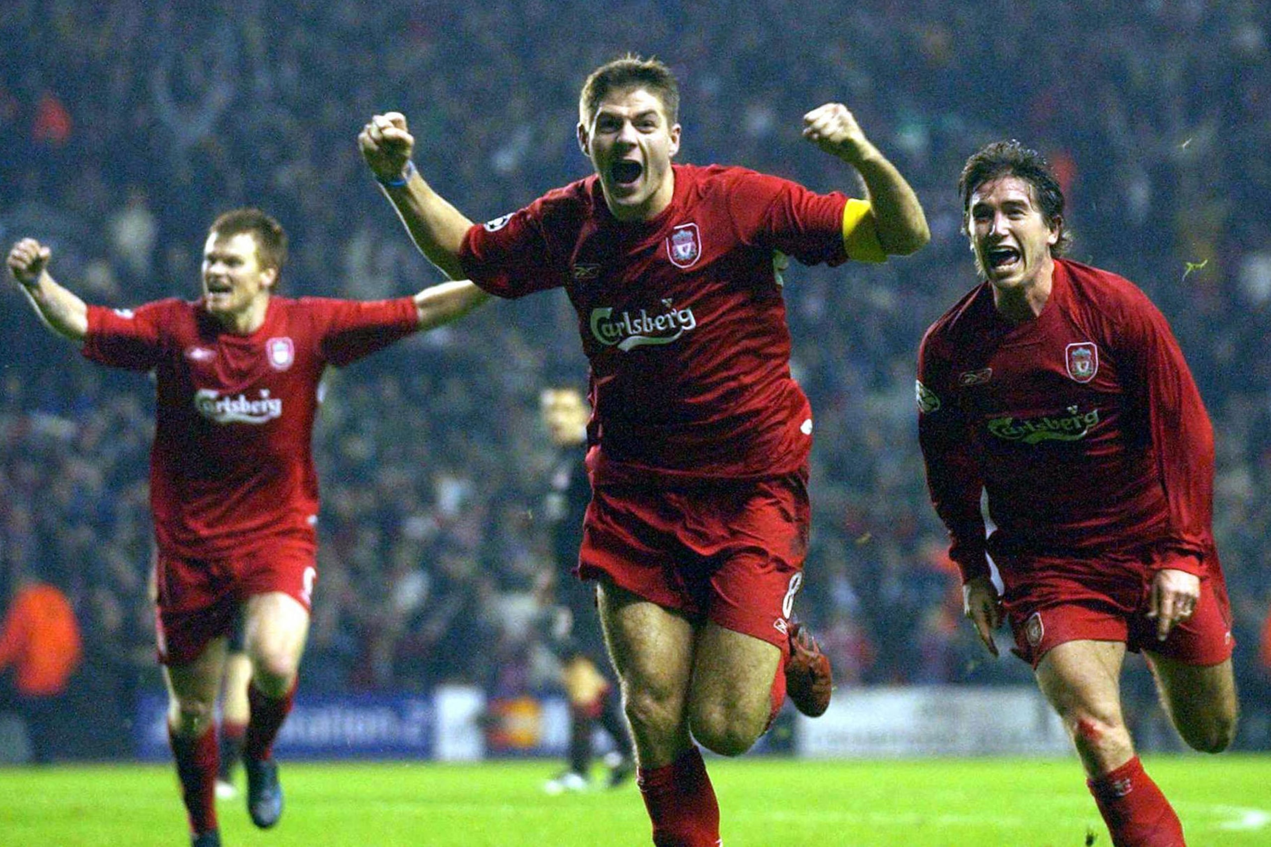 LIVERPOOL, UNITED KINGDOM: Liverpool's Steven Gerard (c) flanked by John Arne Riise (l) and Harry Kew ll (r) celebrates scoring to make it 3-1 against Olympiakos CFP during their UEFA Champions League clash at Anfield, Liverpool08 December 2004. AFP phot LIVERPOOL, UNITED KINGDOM: Liverpool's Steven Gerard (c) flanked by John Arne Riise (l) and Harry Kew ll (r) celebrates scoring to make it 3-1 against Olympiakos CFP during their UEFA Champions League clash at Anfield, Liverpool08 December 2004. AFP phot