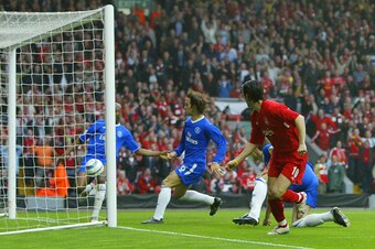 LIVERPOOL, United Kingdom:  Liverpool's Luis Garcia (R) watches as Chelsea's William Gallas (L) attempts to clear the ball from Chelsea's goal during their second leg semi-final football match at Anfield in Liverpool, England, 02 May, 2005.    AFP PHOTO/A