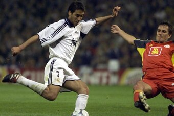 MADRID, SPAIN - APRIL 18:  Real Madrid's Raul (L), who scored two goals during the game,  fights for the ball with Istanbul Galatasaray's Kaya Suat 18 April 2001, during their Champions League quarter final second leg match in Madrid. Real Madrid won 3-0 