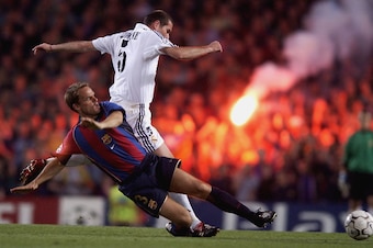 23 Apr 2002:  Frank De Boer of Barcelona tackles Zinedine Zidane of Real Madrid during the Barcelona v Real Madrid Champions League semi-final, first leg at the Nou Camp Stadium, Barcelona, Spain . DIGITAL IMAGE.  Mandatory Credit: Clive Brunskill/GettyIm