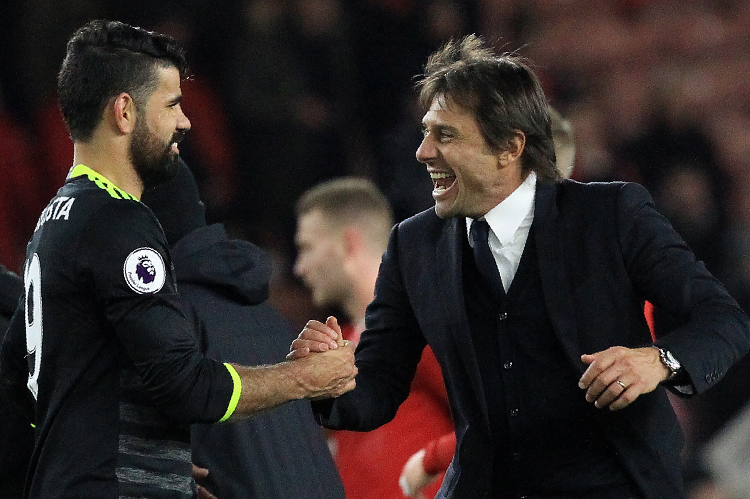 Chelsea's Italian head coach Antonio Conte (R) reacts as he congratulates Chelsea's Brazilian-born Spanish striker Diego Costa following the English Premier League football match between Middlesbrough and Cheslea at Riverside Stadium in Middlesbrough, nor