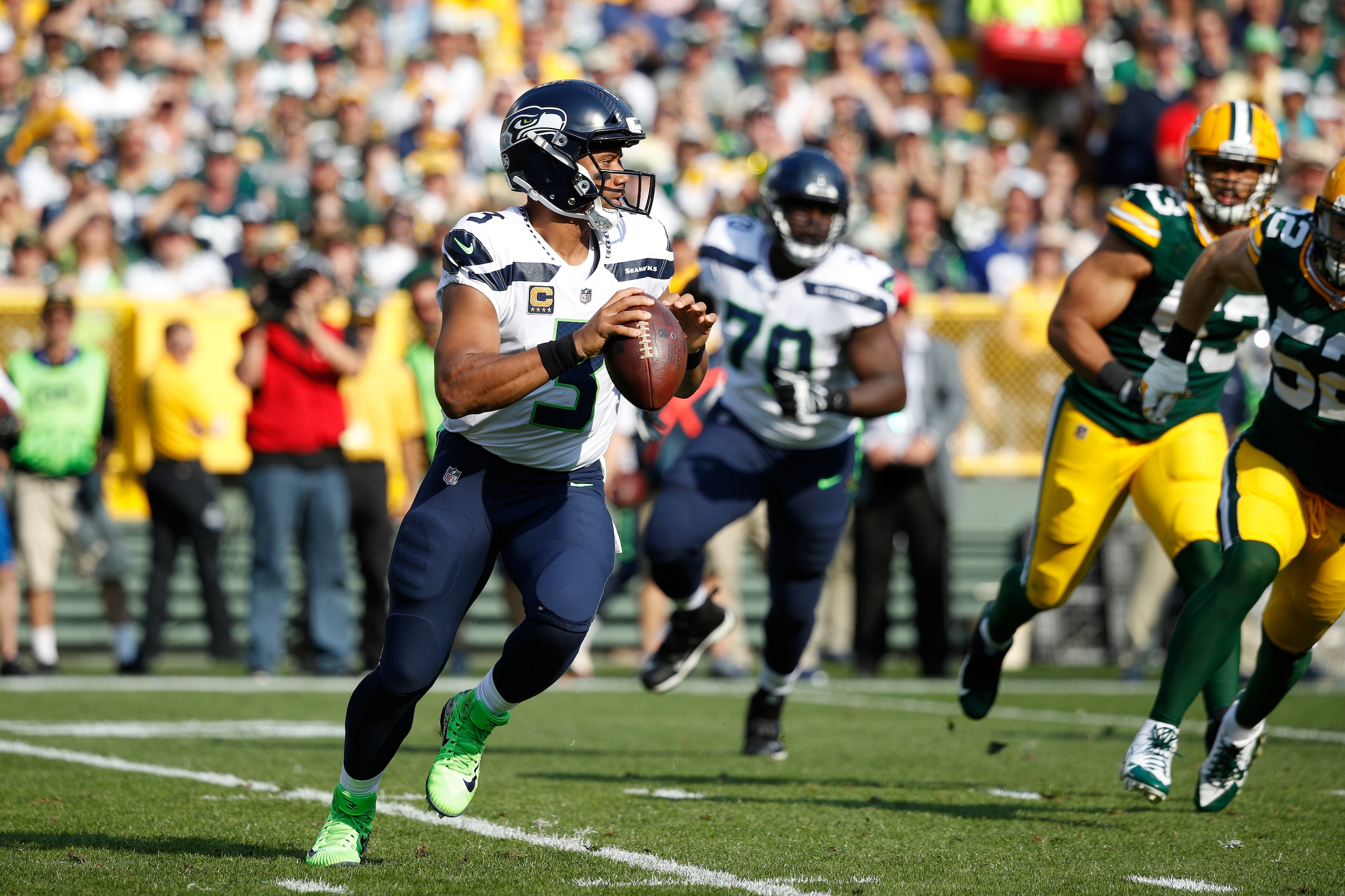 GREEN BAY, WI - SEPTEMBER 10: Russell Wilson #3 of the Seattle Seahawks looks to pass during a game against the Green Bay Packers at Lambeau Field on September 10, 2017 in Green Bay, Wisconsin. The Packers won 17-9. (Photo by Joe Robbins/Getty Images)