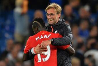 Liverpool's German manager Jurgen Klopp (R) celebrates with Liverpool's Senegalese midfielder Sadio Mane folowing the English Premier League football match between Chelsea and Liverpool at Stamford Bridge in London on September 16, 2016.
Liverpool won the