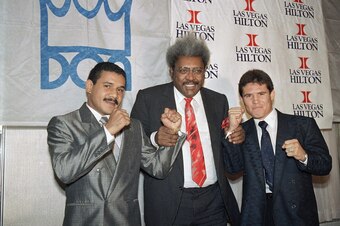 Edwin Rosario (left) and Julio Cesar Chavez pose with promoter Don King.